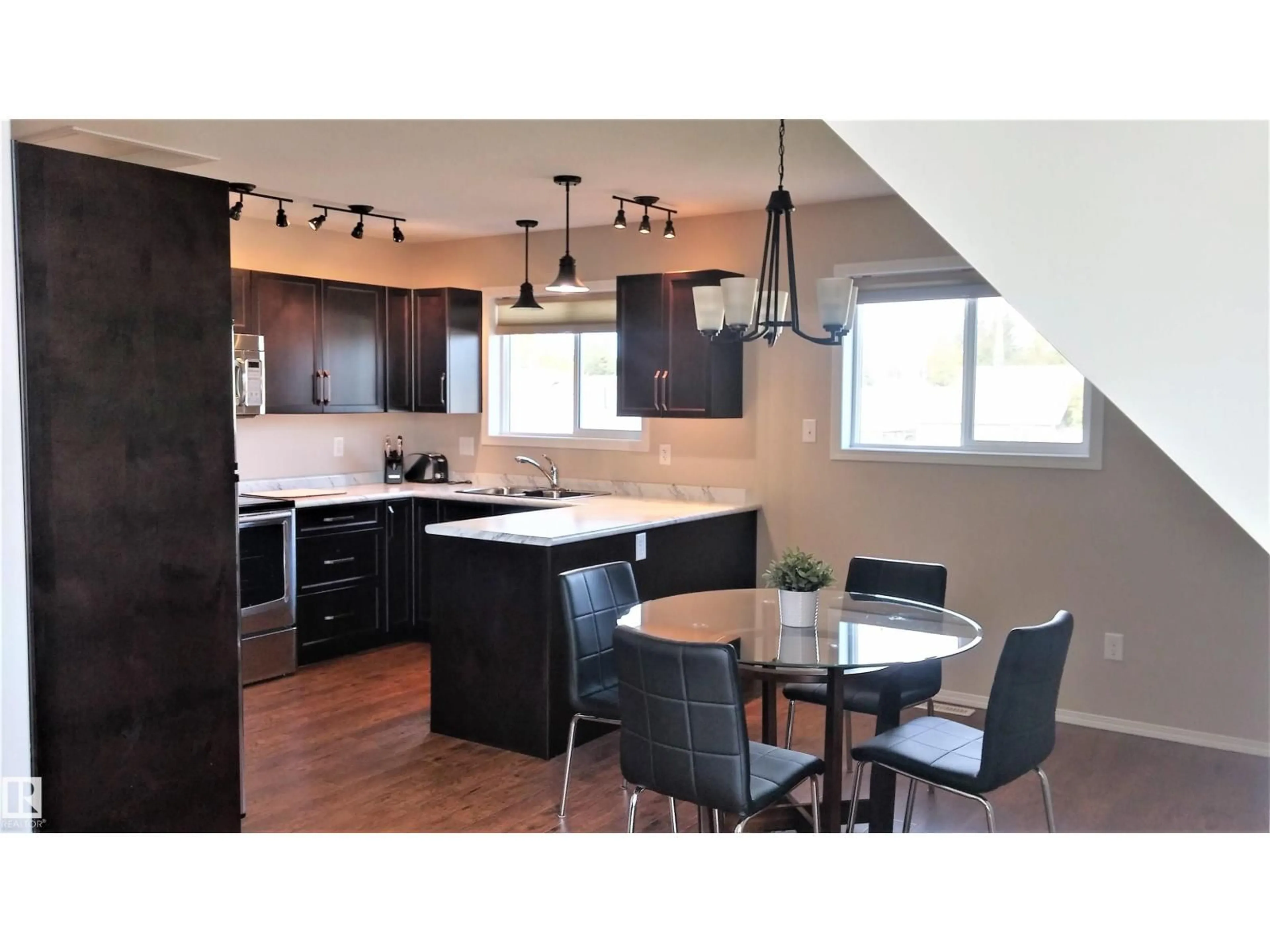 Open concept kitchen, wood/laminate floor for 614 10 ST, Cold Lake Alberta T9M1B1