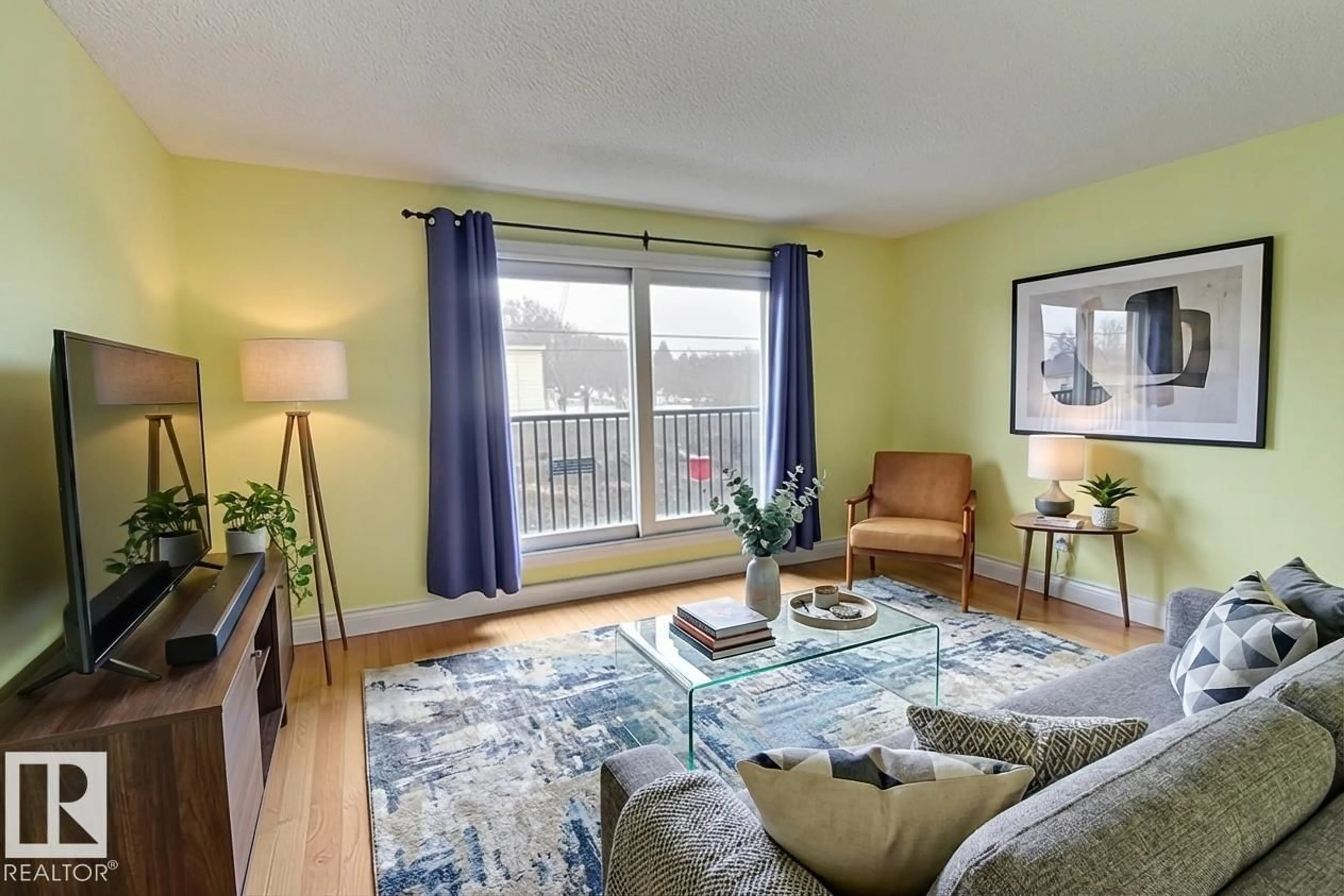 Living room with furniture, wood/laminate floor for 305 - 10740 105 ST NW, Edmonton Alberta T5H2X2