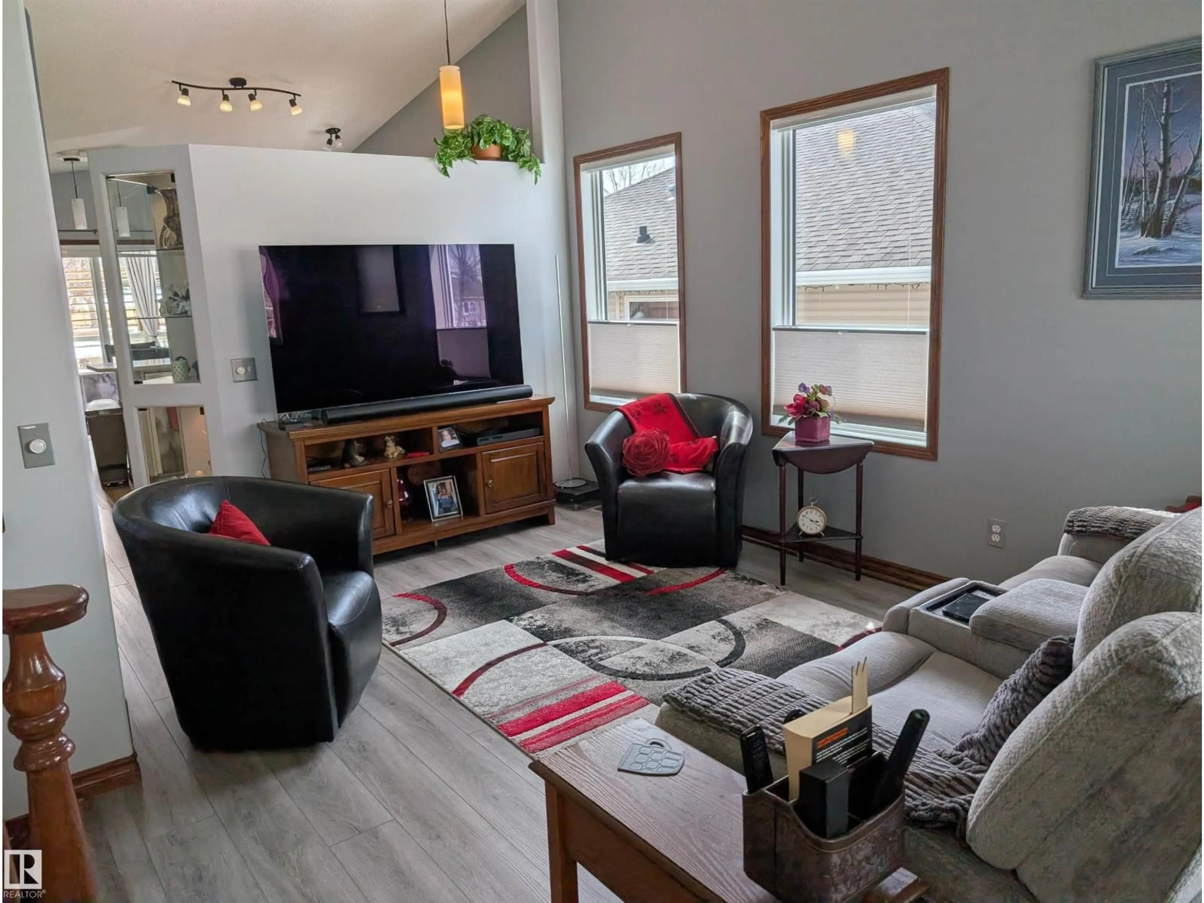 Living room with furniture, wood/laminate floor for 65 COLONIALE WY, Beaumont Alberta T4X1M3