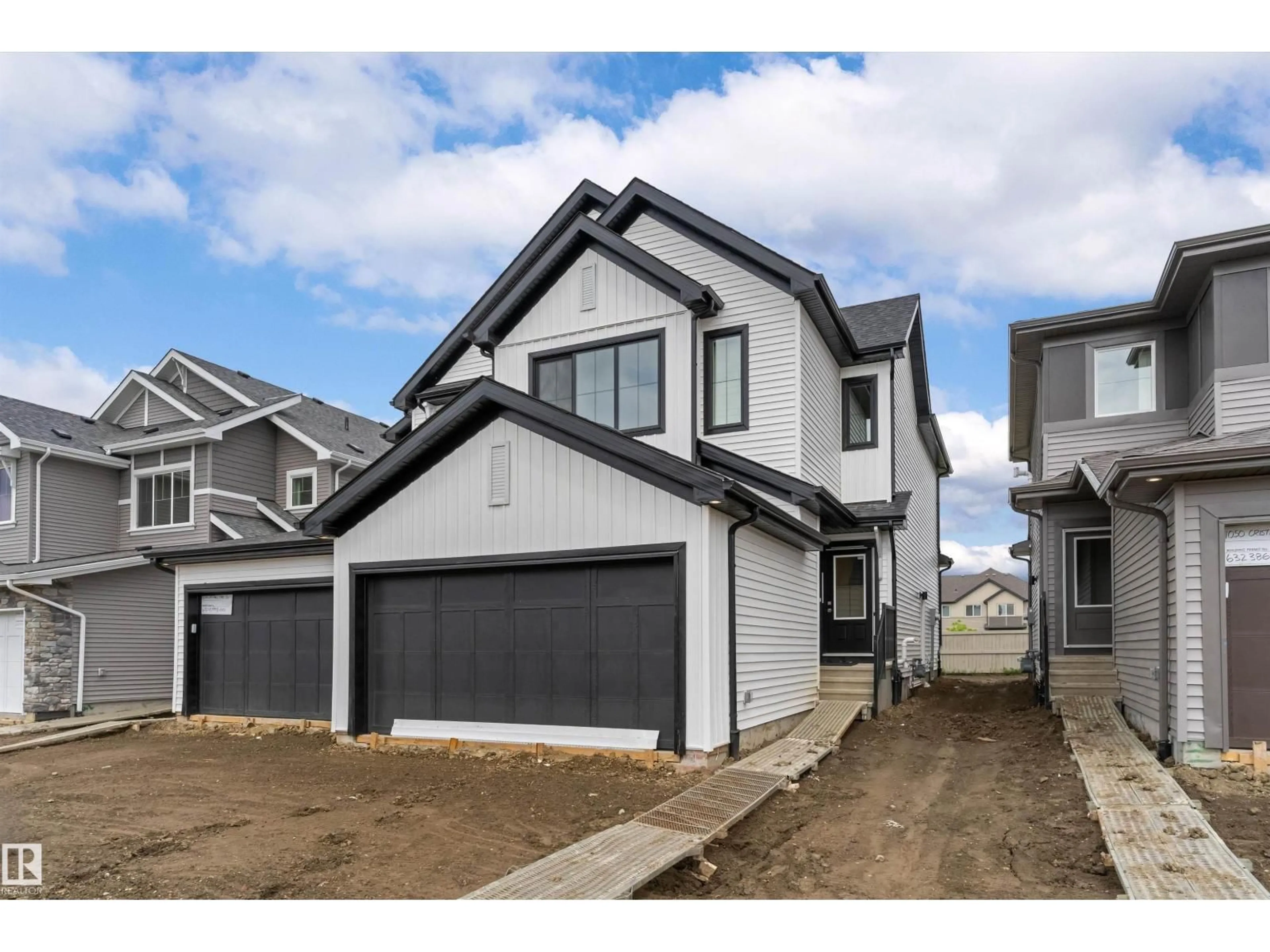 Home with vinyl exterior material, street for 1052 CRISTALL CR, Edmonton Alberta T6W5S6