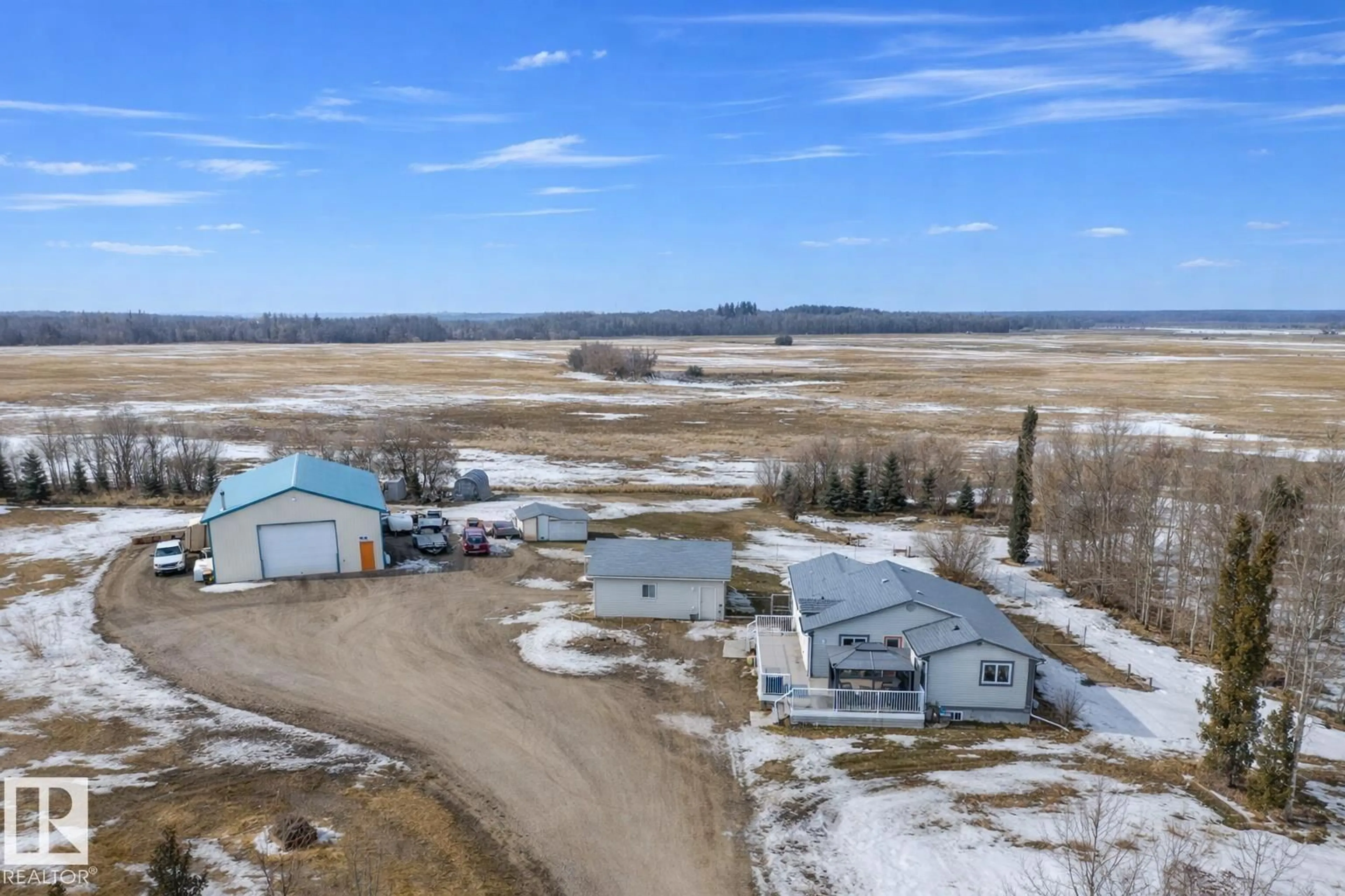 A pic from outside/outdoor area/front of a property/back of a property/a pic from drone, water/lake/river/ocean view for 23021 TWP ROAD 502, Rural Leduc County Alberta T0B3M1