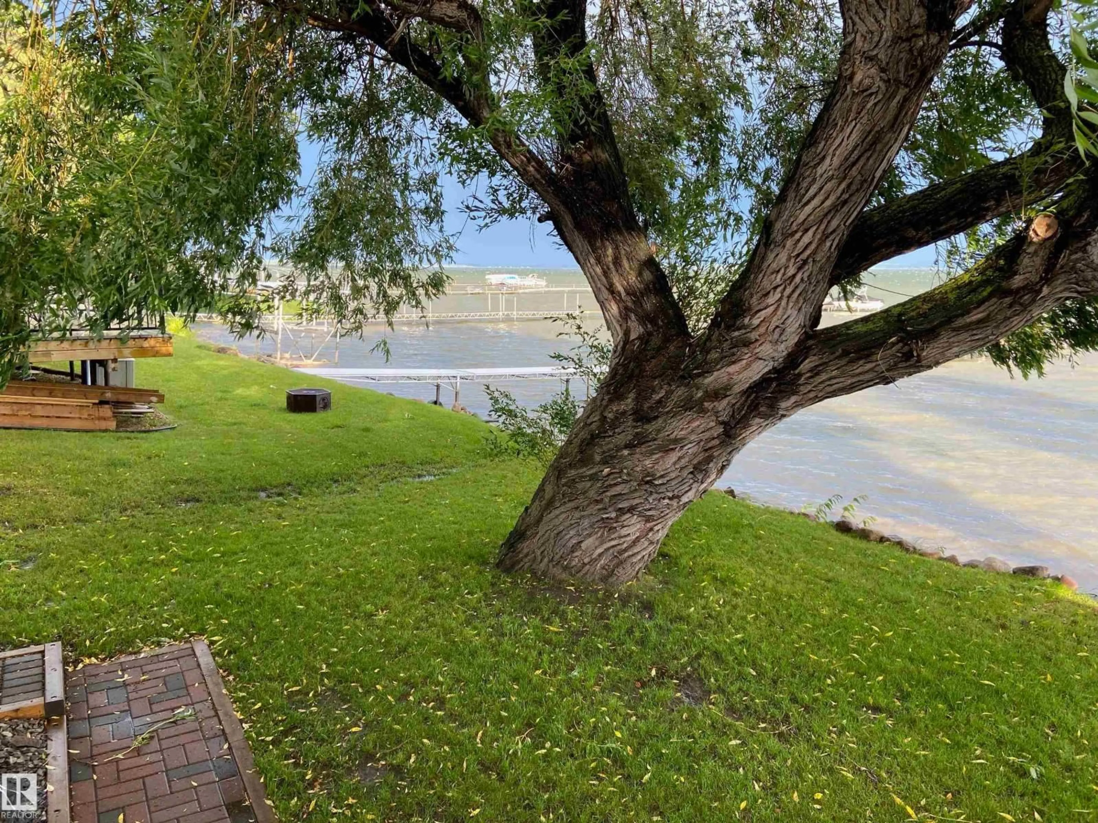 A pic from outside/outdoor area/front of a property/back of a property/a pic from drone, water/lake/river/ocean view for 707 7 ST, Rural Lac Ste. Anne County Alberta T0E1V0