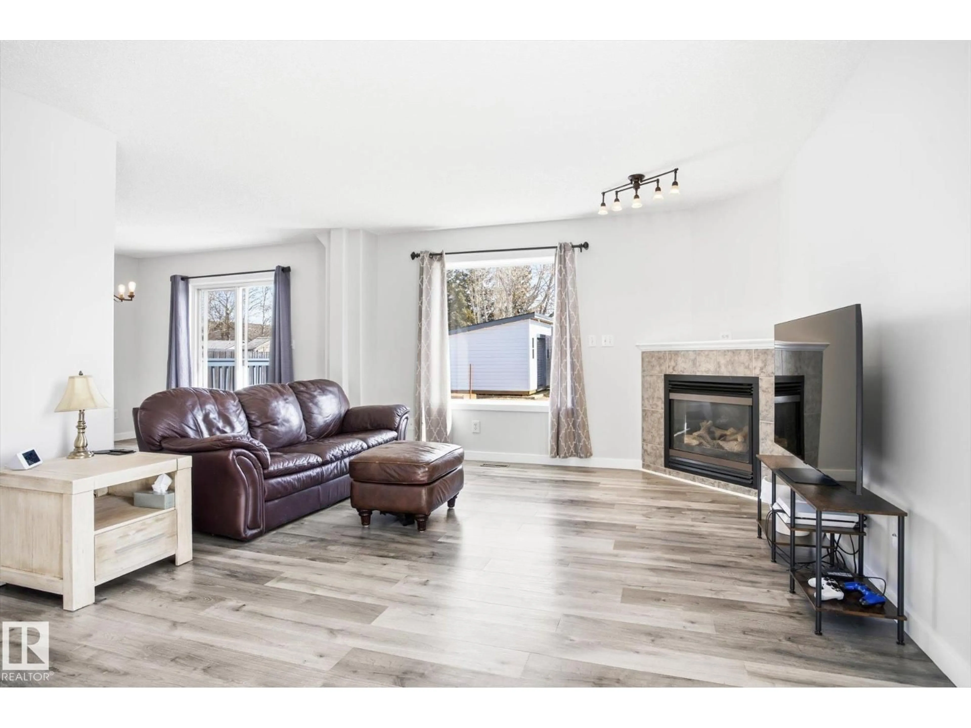 Living room with furniture, wood/laminate floor for 201 FOXBORO CT, Sherwood Park Alberta T8A5Y5