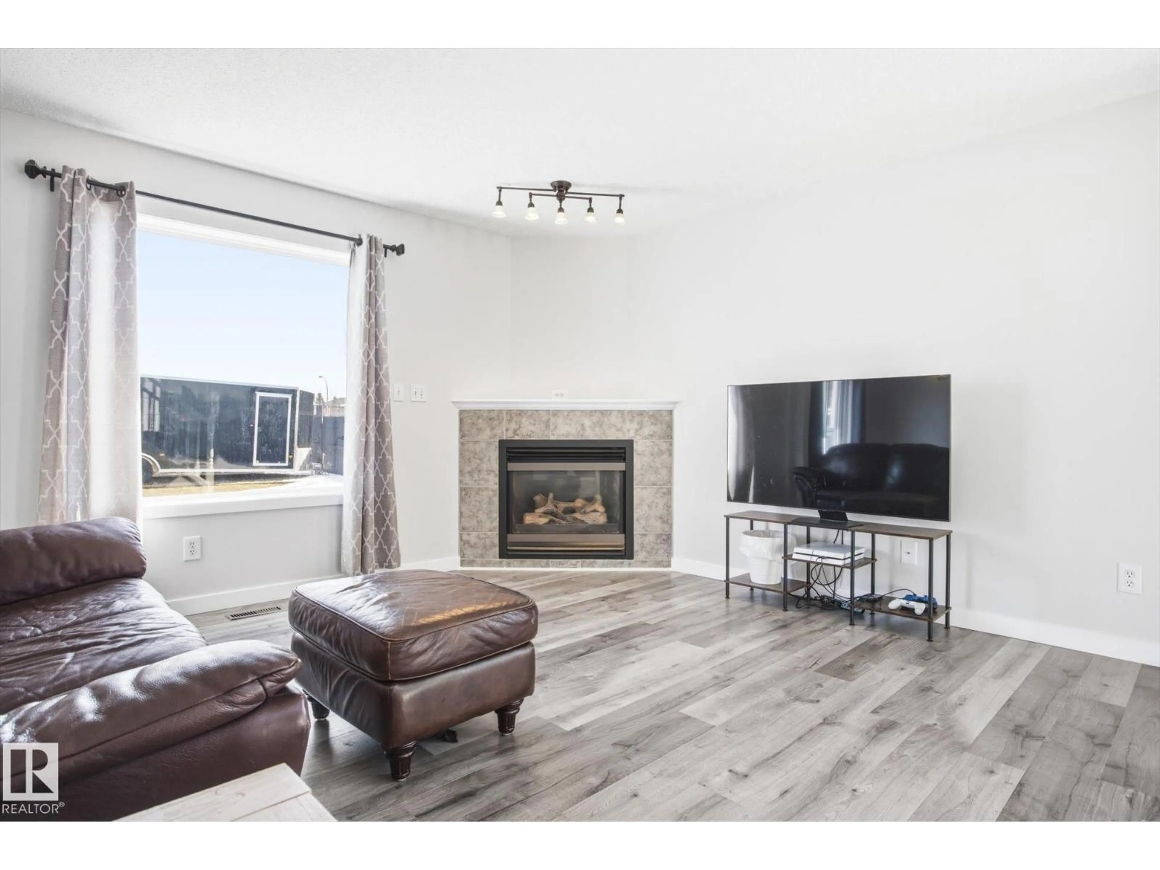 Living room with furniture, wood/laminate floor for 201 FOXBORO CT, Sherwood Park Alberta T8A5Y5