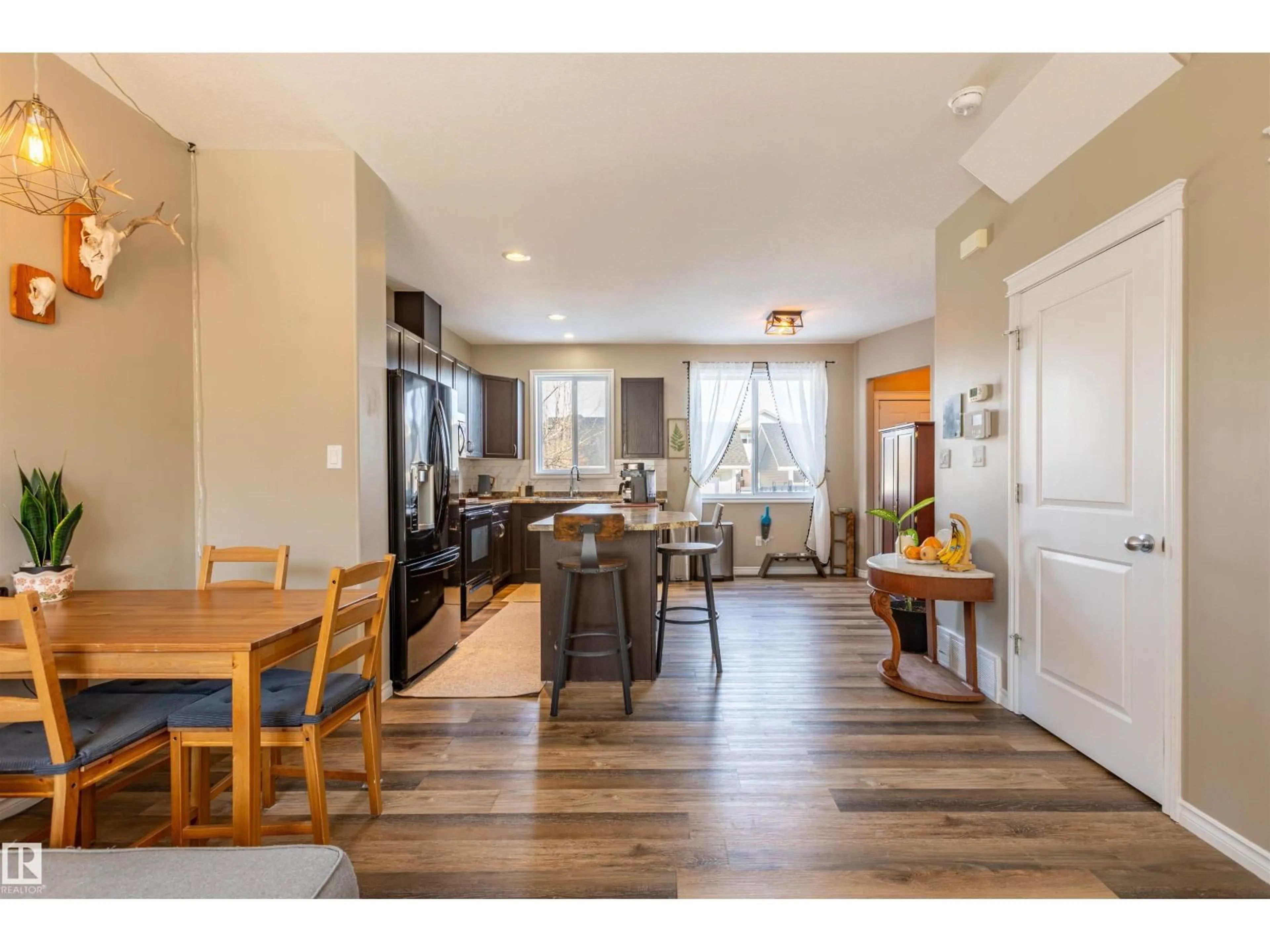 Open concept kitchen, wood/laminate floor for 9830 105 AV, Morinville Alberta T8R0C1