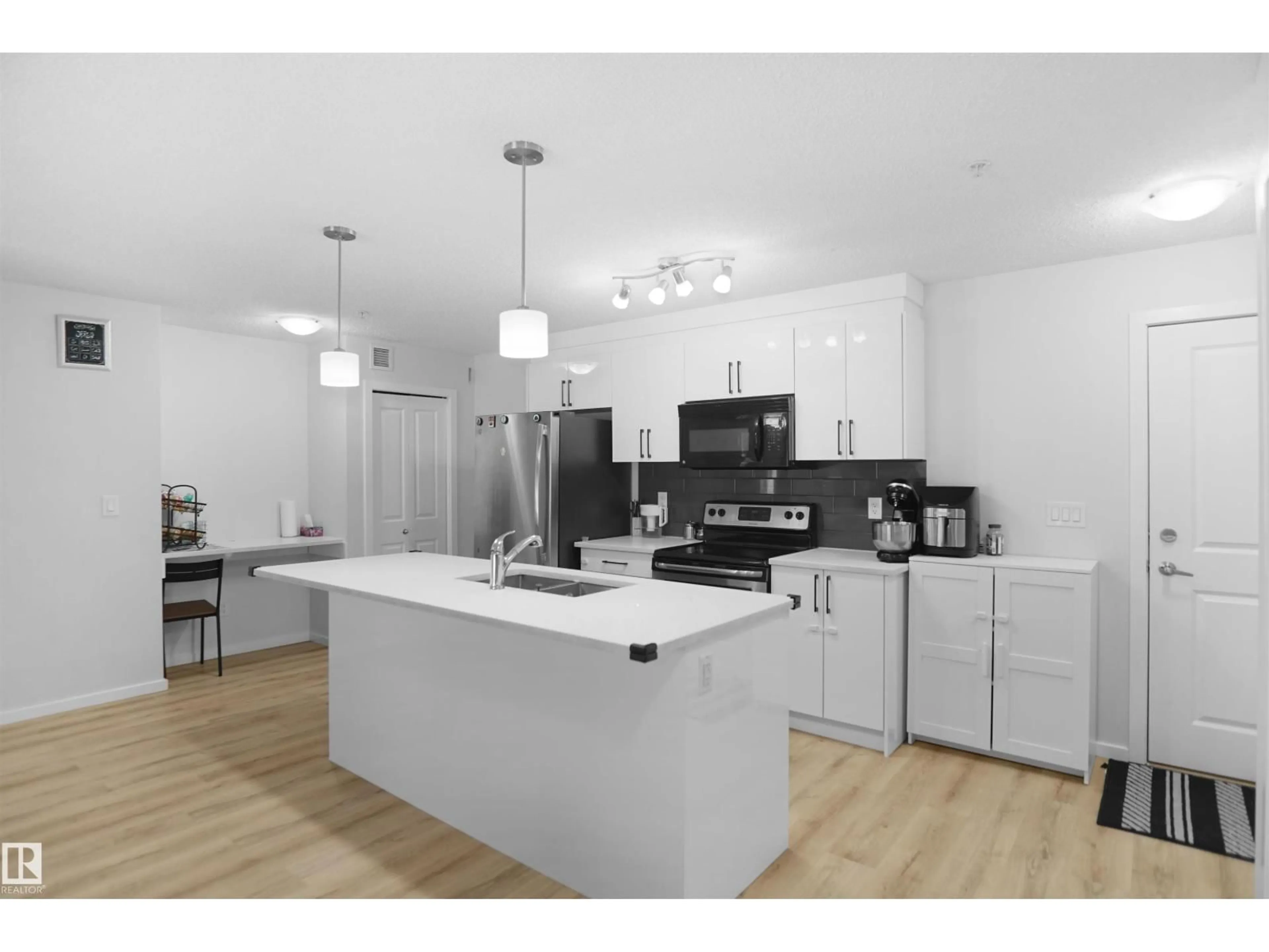 Open concept kitchen, unknown for #103 - 3353 16A AV, Edmonton Alberta T6T0V4