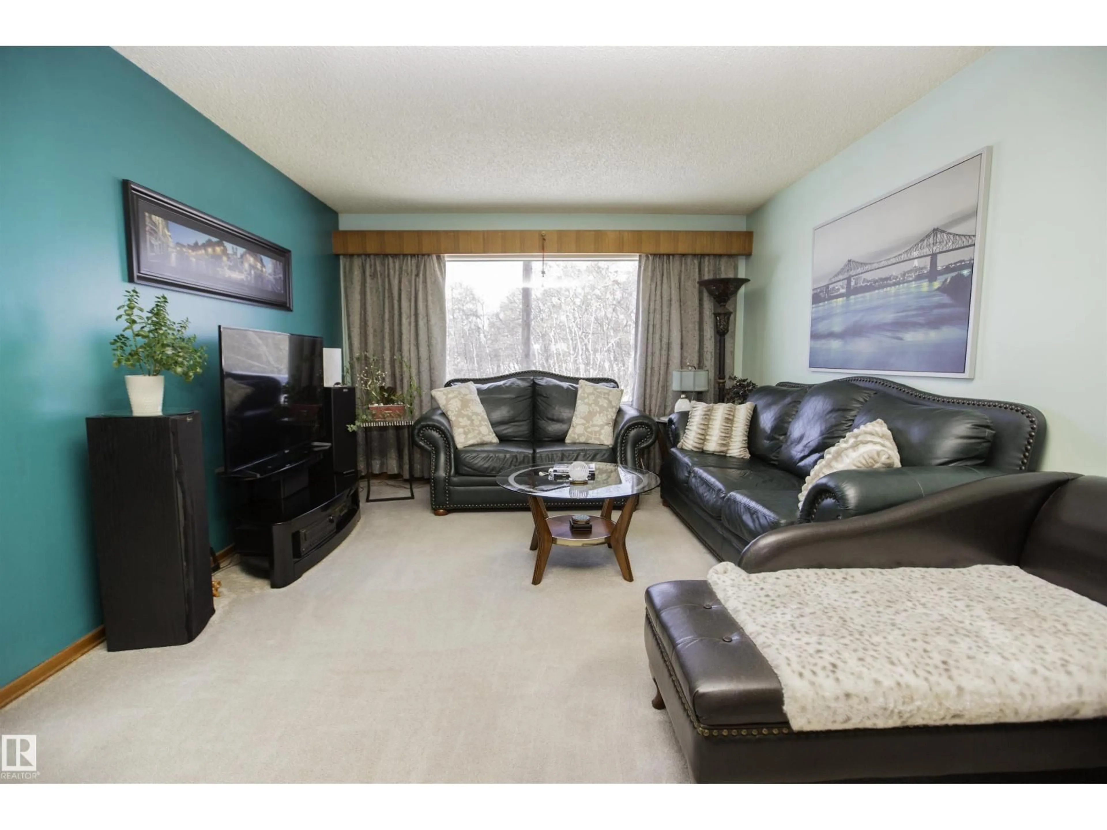Living room with furniture, wood/laminate floor for 12827 109 ST, Edmonton Alberta T5E4Y2