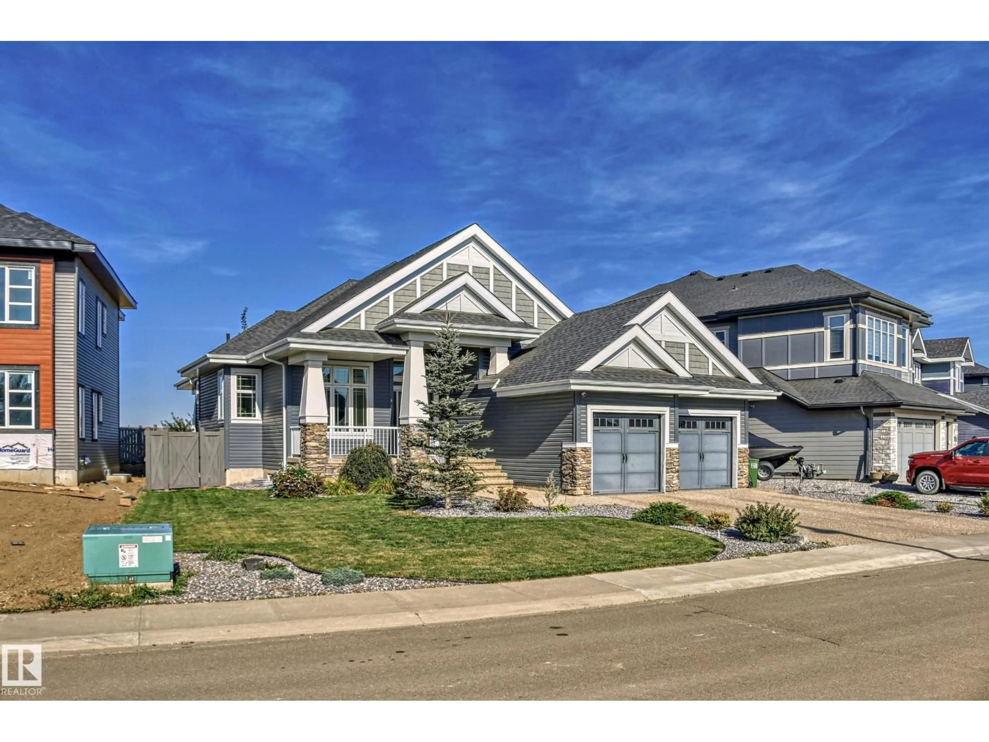 Home with vinyl exterior material, street for 3908 GINSBURG CR, Edmonton Alberta T5T4V2