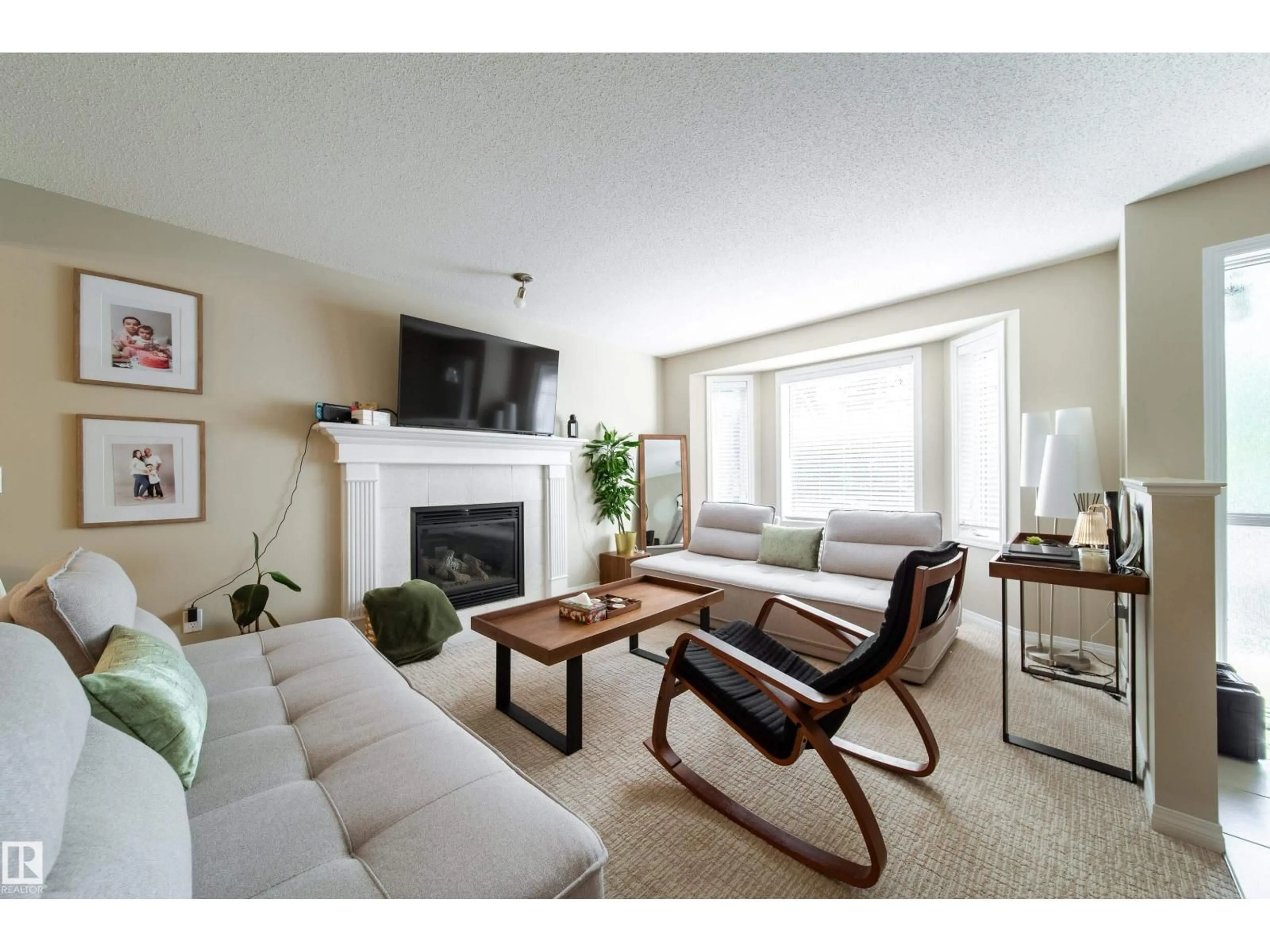 Living room with furniture, unknown for NW - 8118-8120 81 AV, Edmonton Alberta T6C0V9