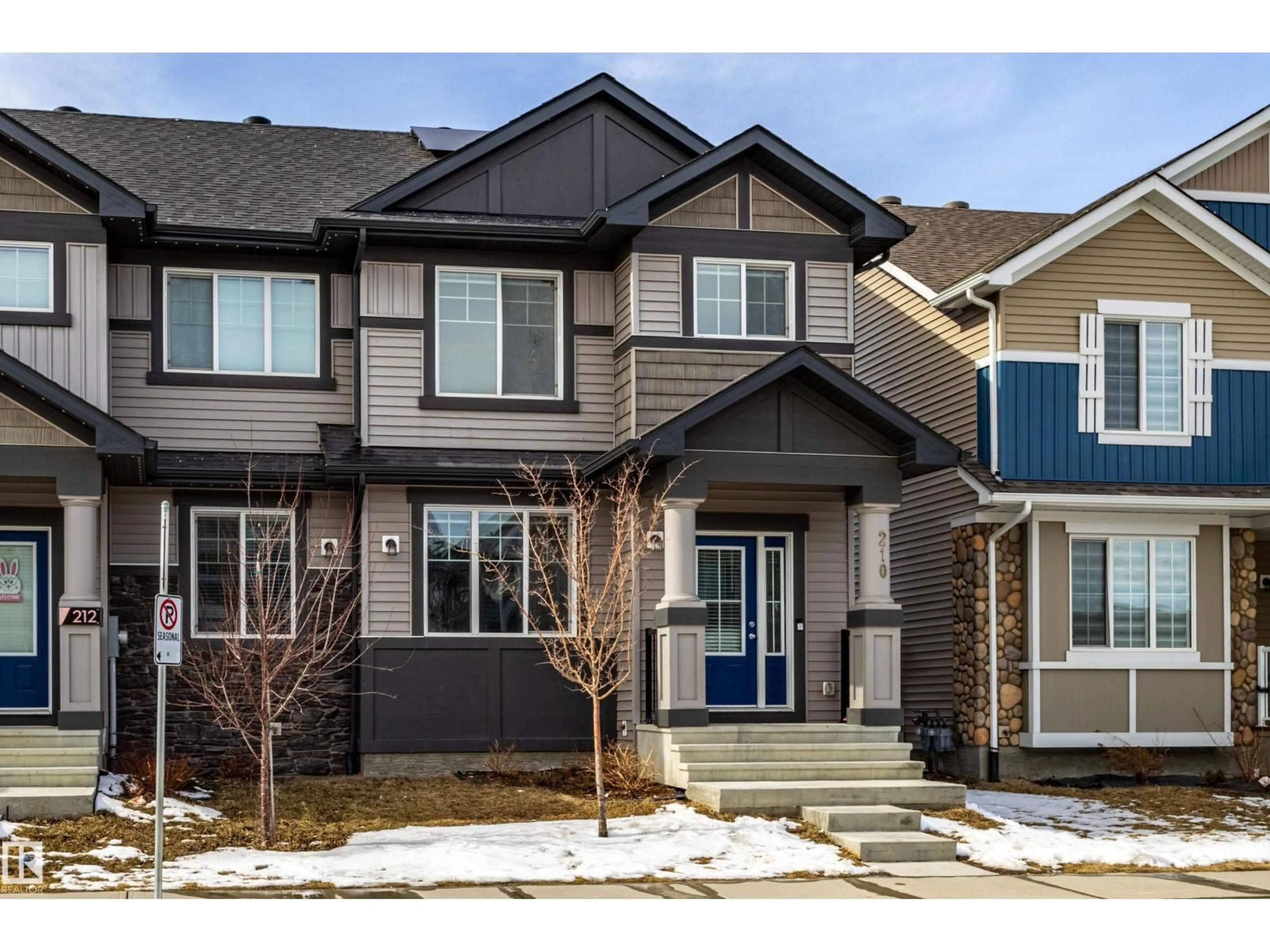 Home with vinyl exterior material, street for 210 DESROCHERS BV, Edmonton Alberta T6W4N2
