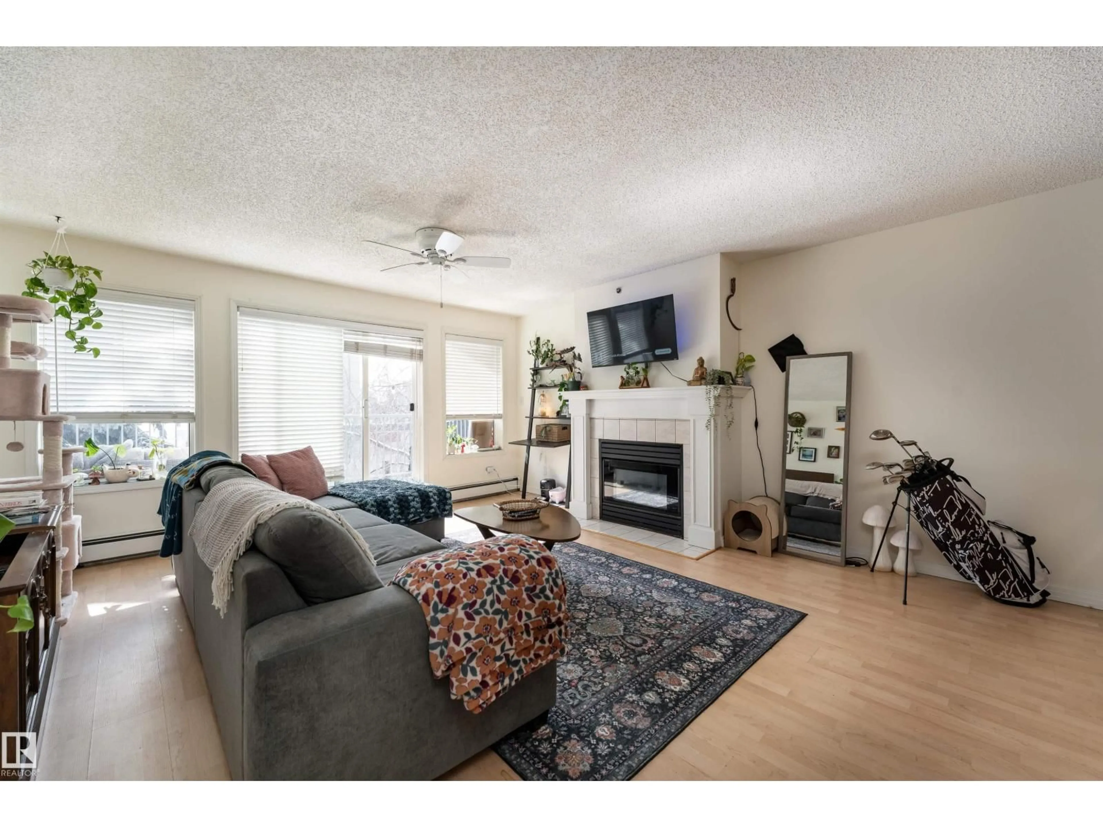 Living room with furniture, wood/laminate floor for 315 10508 119 ST NW, Edmonton Alberta T5H4M1