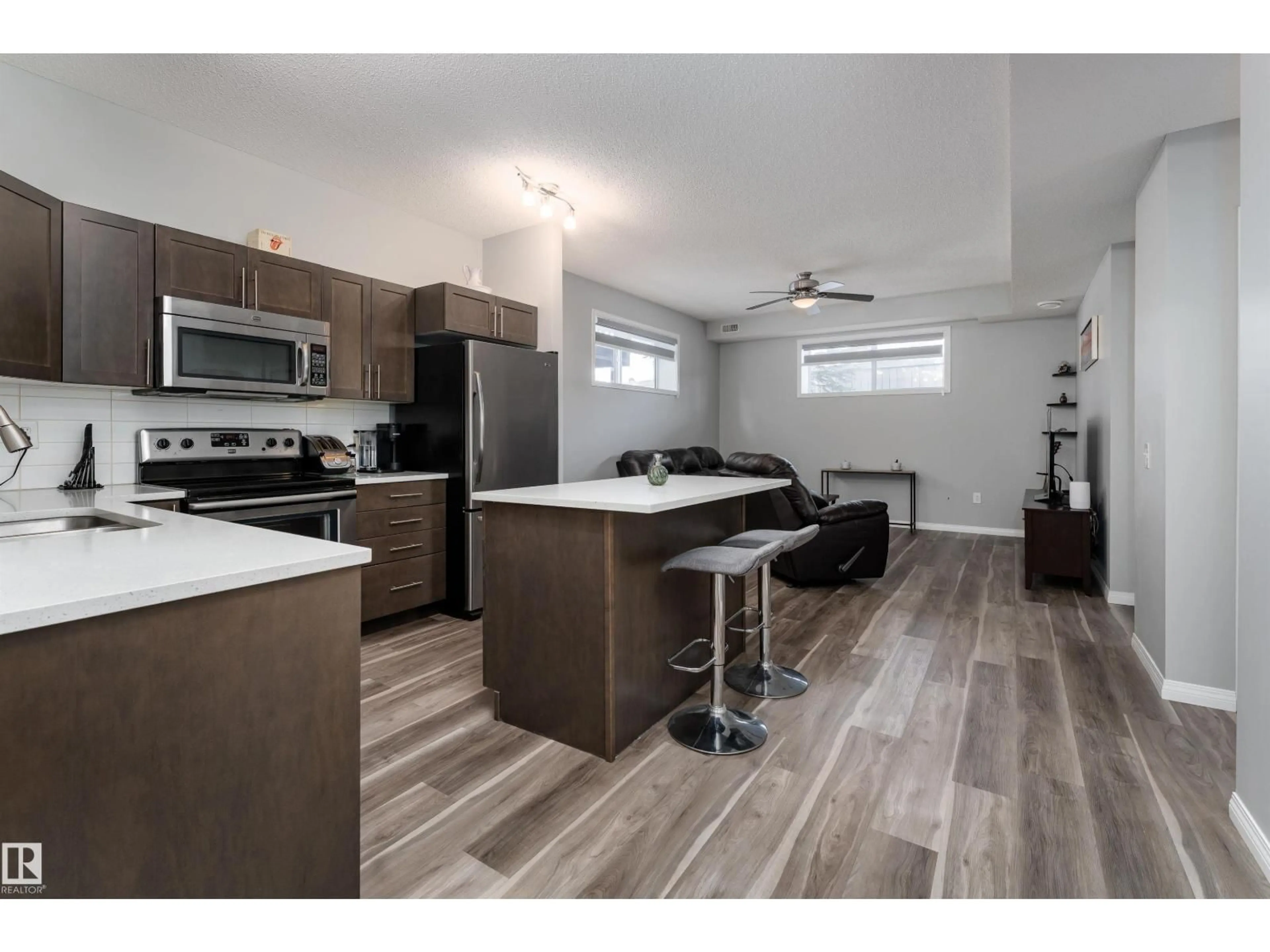 Open concept kitchen, wood/laminate floor for #23 - 6520 2 AV SW, Edmonton Alberta T6X0B5