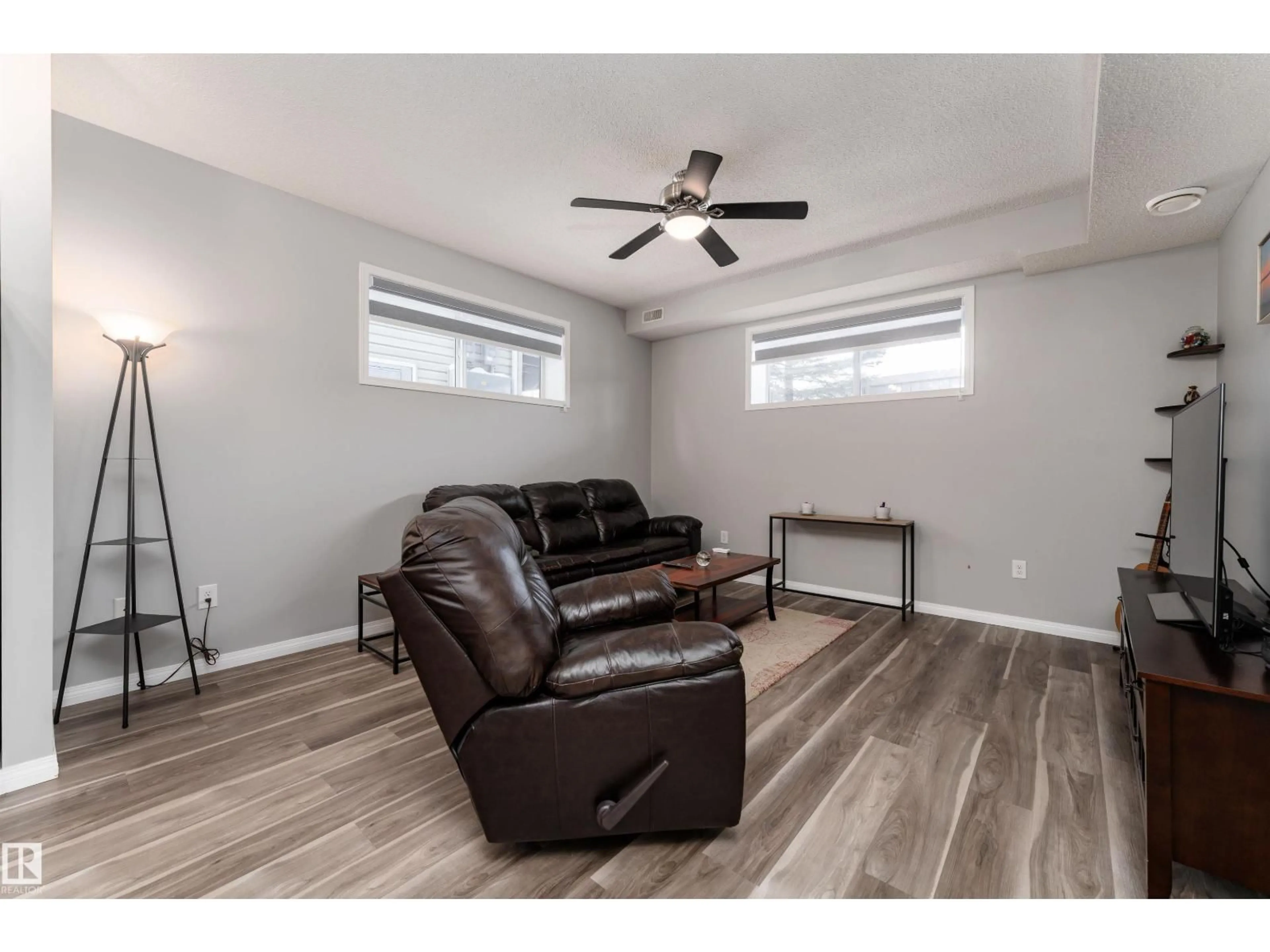 Living room with furniture, wood/laminate floor for #23 - 6520 2 AV SW, Edmonton Alberta T6X0B5