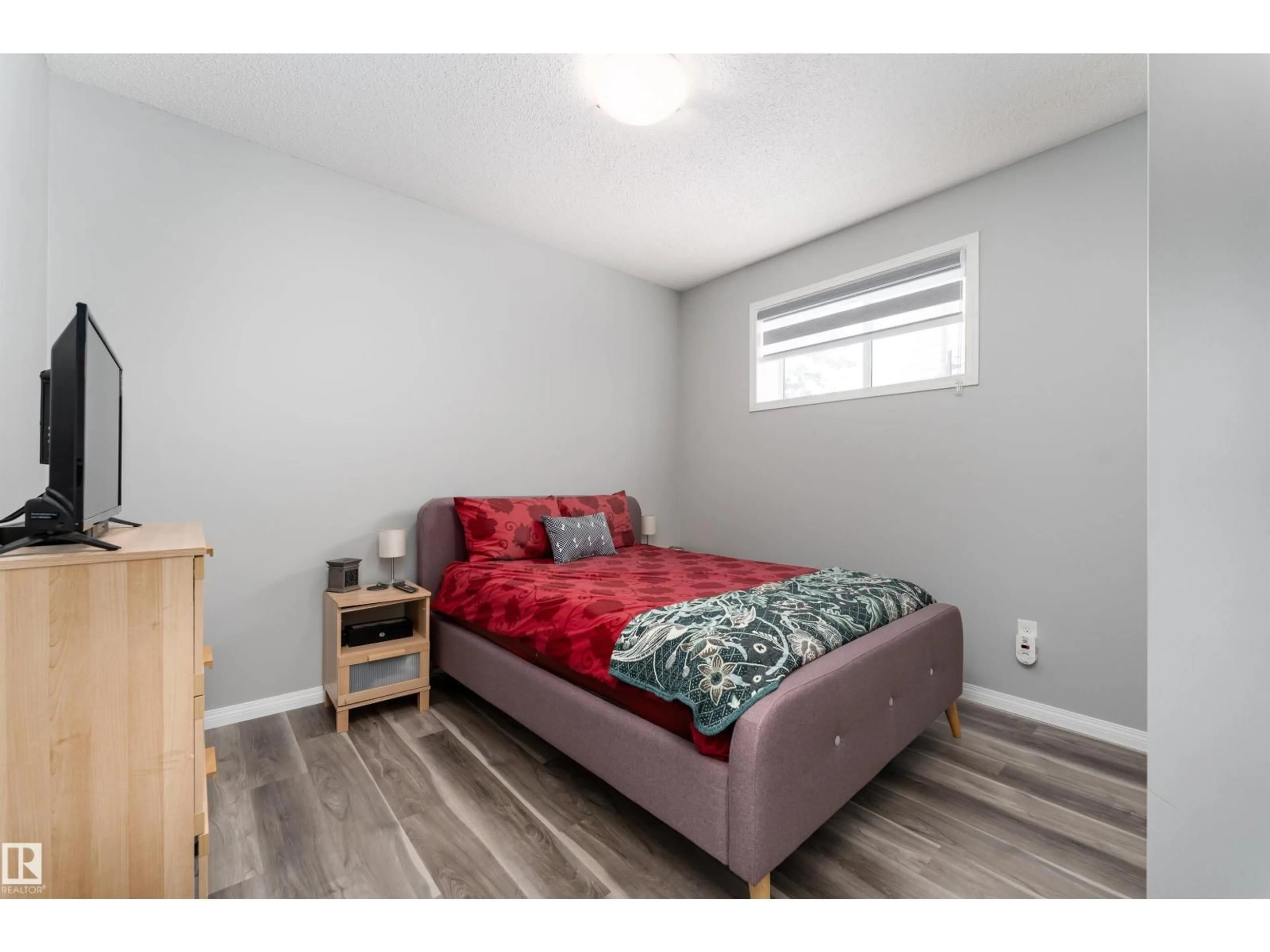 Bedroom with bed, wood/laminate floor for #23 - 6520 2 AV SW, Edmonton Alberta T6X0B5