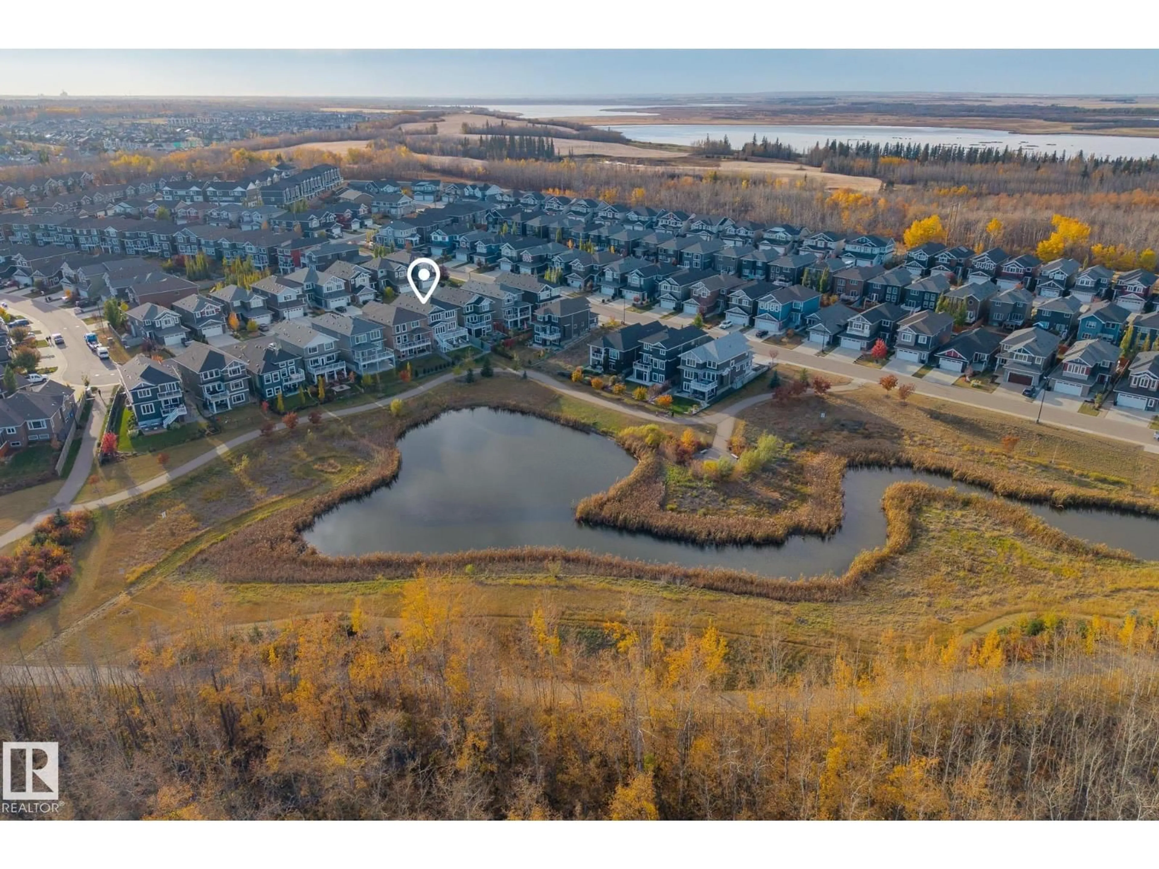 A pic from outside/outdoor area/front of a property/back of a property/a pic from drone, water/lake/river/ocean view for 3419 CHICKADEE DR, Edmonton Alberta T5A0L1