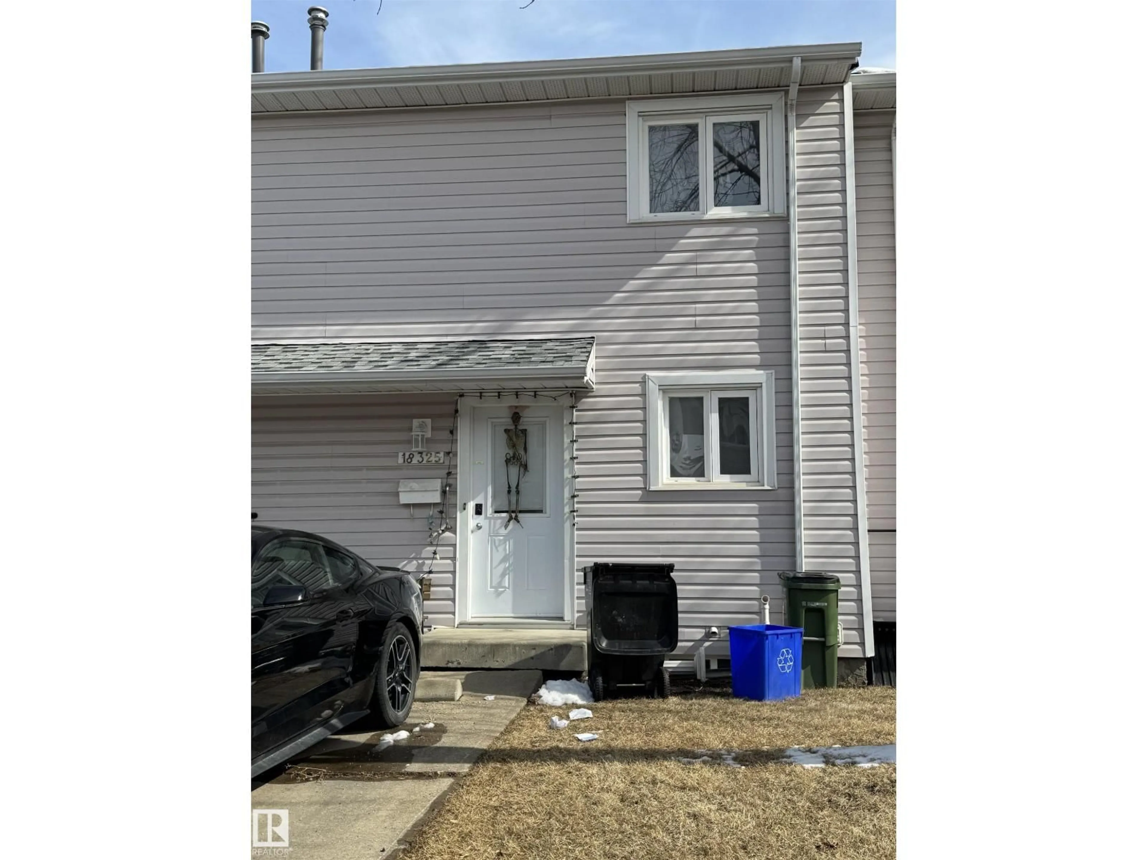 Home with vinyl exterior material, street for 18325 66 AV, Edmonton Alberta T5T1Z9