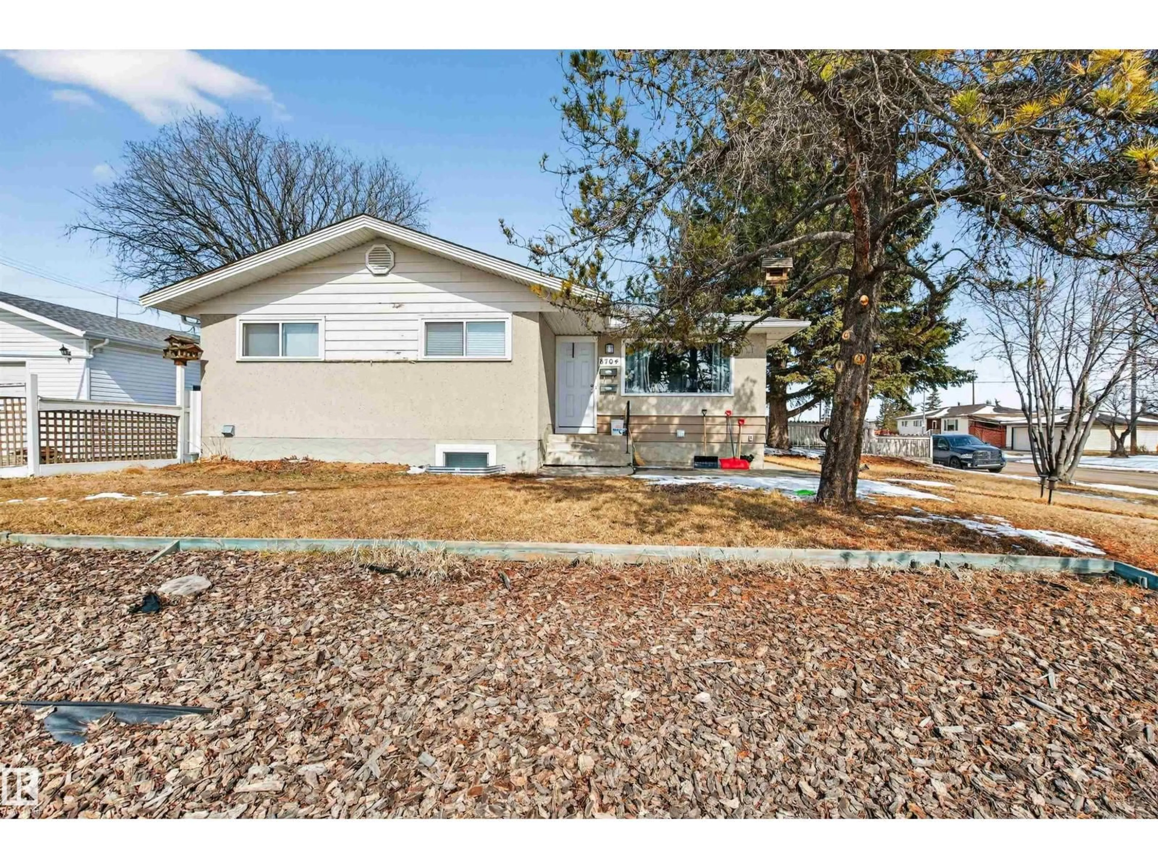 Home with vinyl exterior material, street for 8704 136 AV, Edmonton Alberta T5E3E6