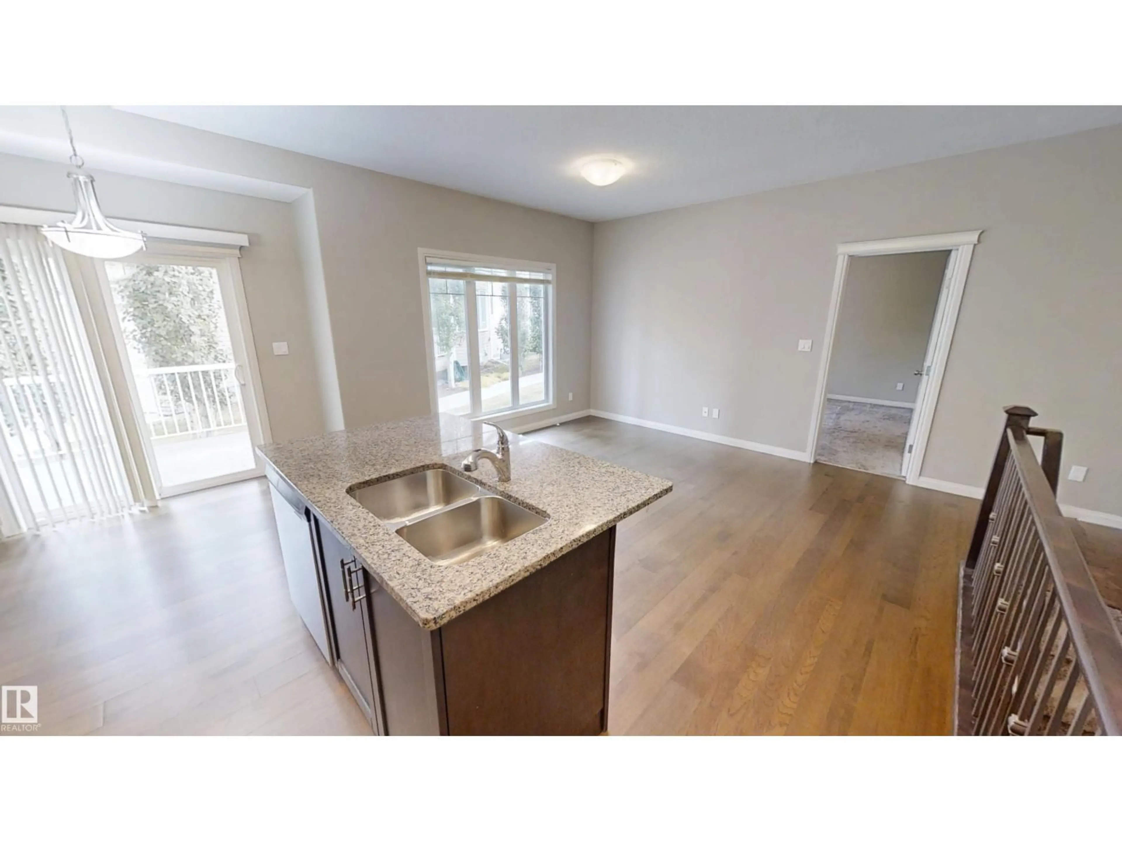 Open concept kitchen, wood/laminate floor for 59 18230 104A ST, Edmonton Alberta T5X0G9