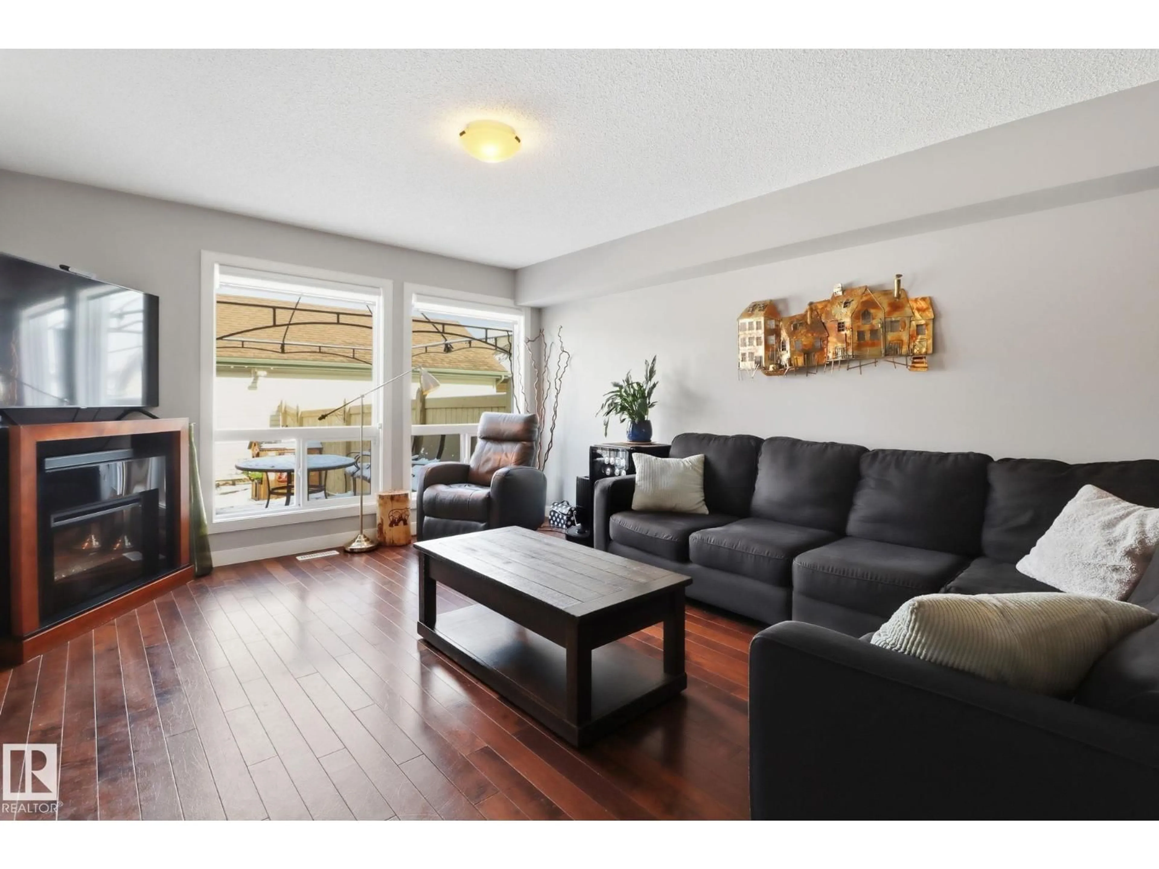 Living room with furniture, wood/laminate floor for SW - 430 WATT BV, Edmonton Alberta T6X1R1