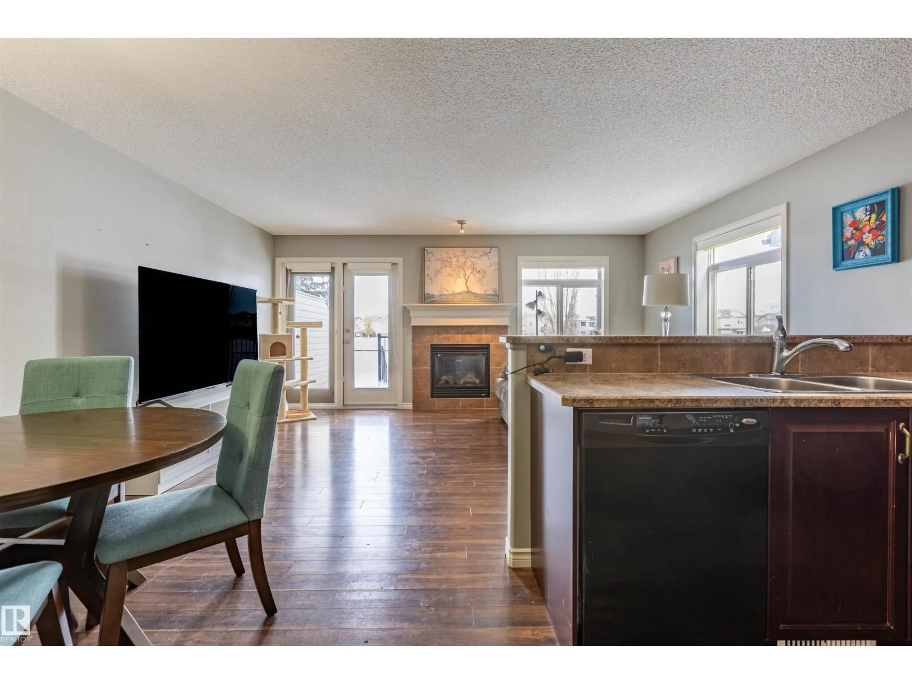 Open concept kitchen, wood/laminate floor for #12 - 9511 102, Morinville Alberta T8R0C6