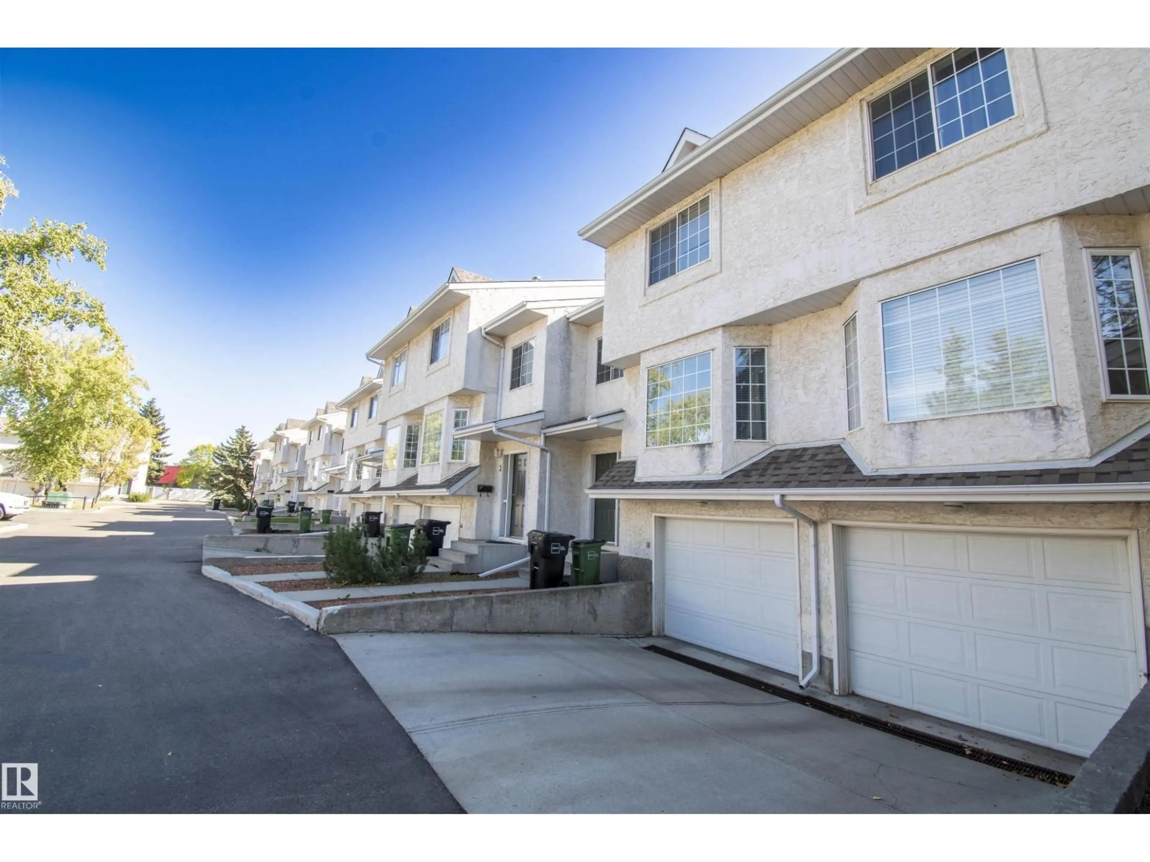 A pic from outside/outdoor area/front of a property/back of a property/a pic from drone, street for #2 - 9703 174 ST, Edmonton Alberta T5T6C5