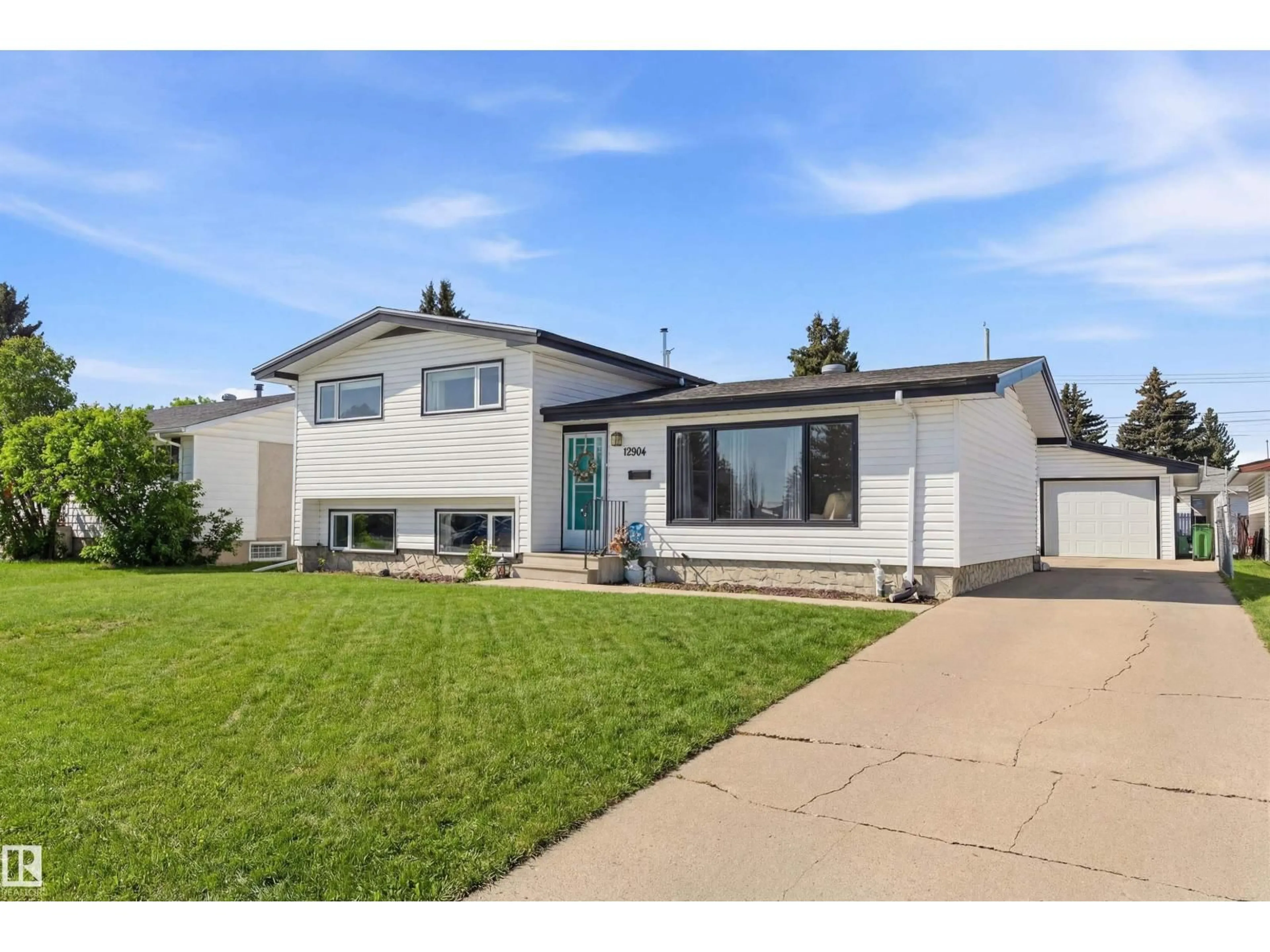 Home with vinyl exterior material, street for 12904 95 ST, Edmonton Alberta T5E3Y1