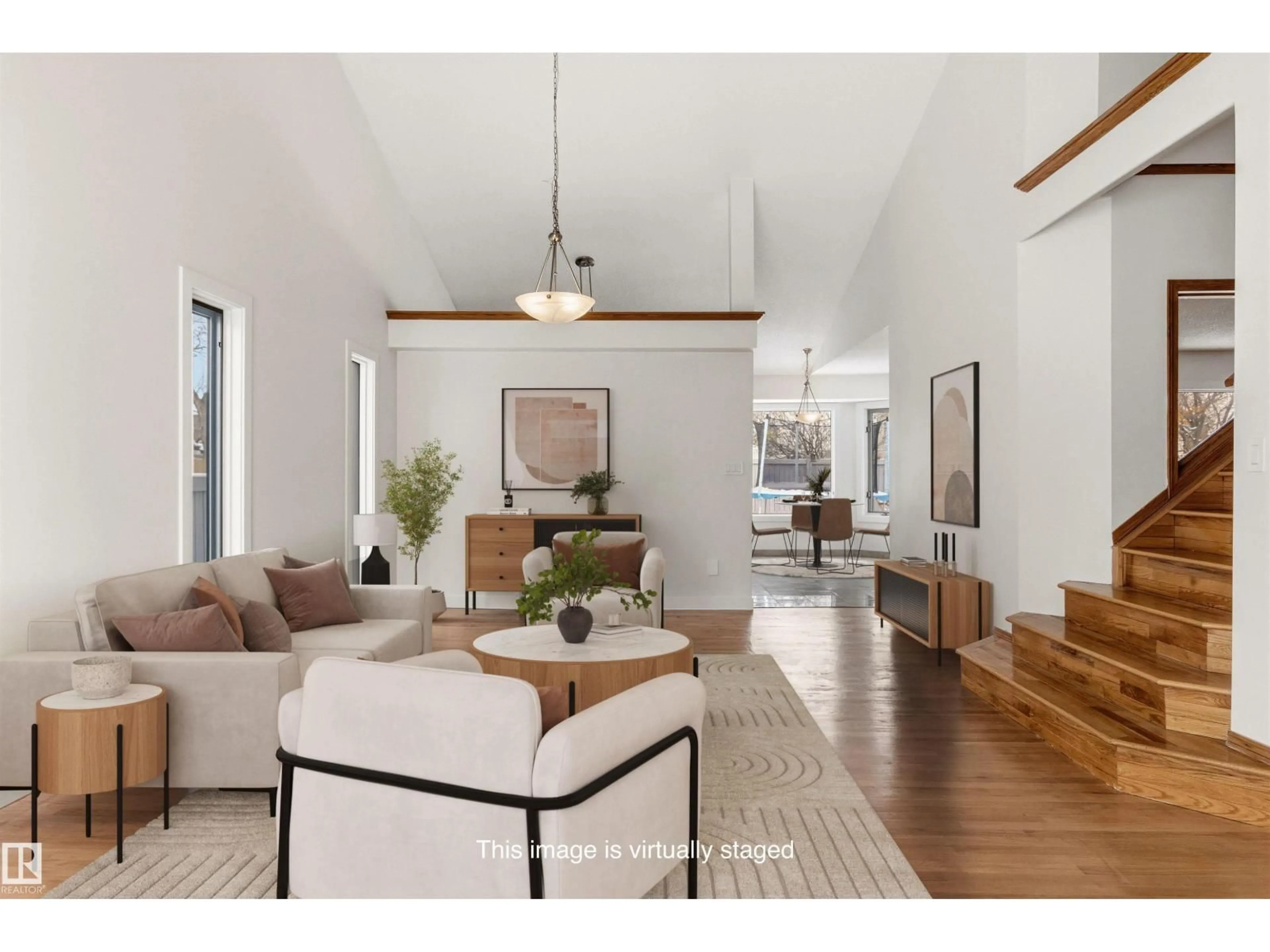 Living room with furniture, wood/laminate floor for 3668 31A ST NW, Edmonton Alberta T6T1H6