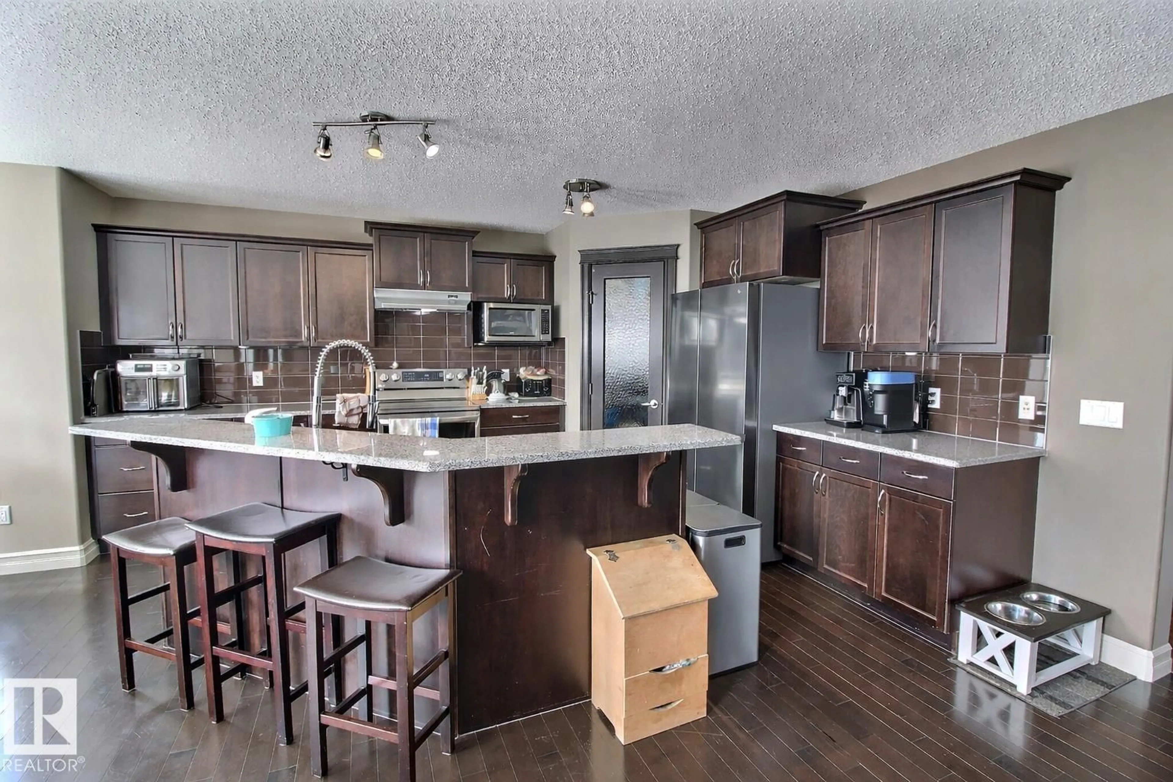 Open concept kitchen, wood/laminate floor for 1212 WESTERRA CR, Stony Plain Alberta T7Z0B2