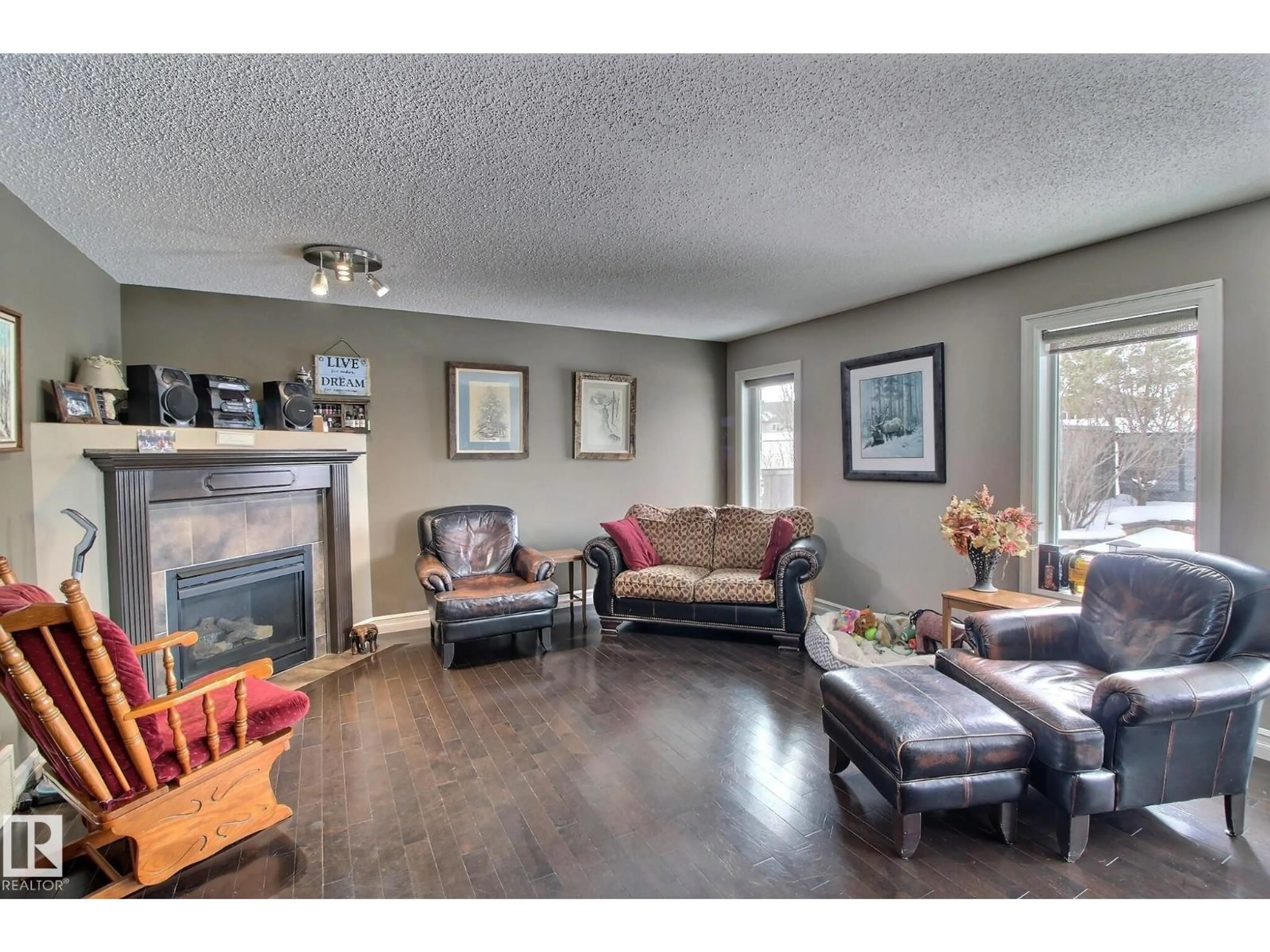 Living room with furniture, wood/laminate floor for 1212 WESTERRA CR, Stony Plain Alberta T7Z0B2