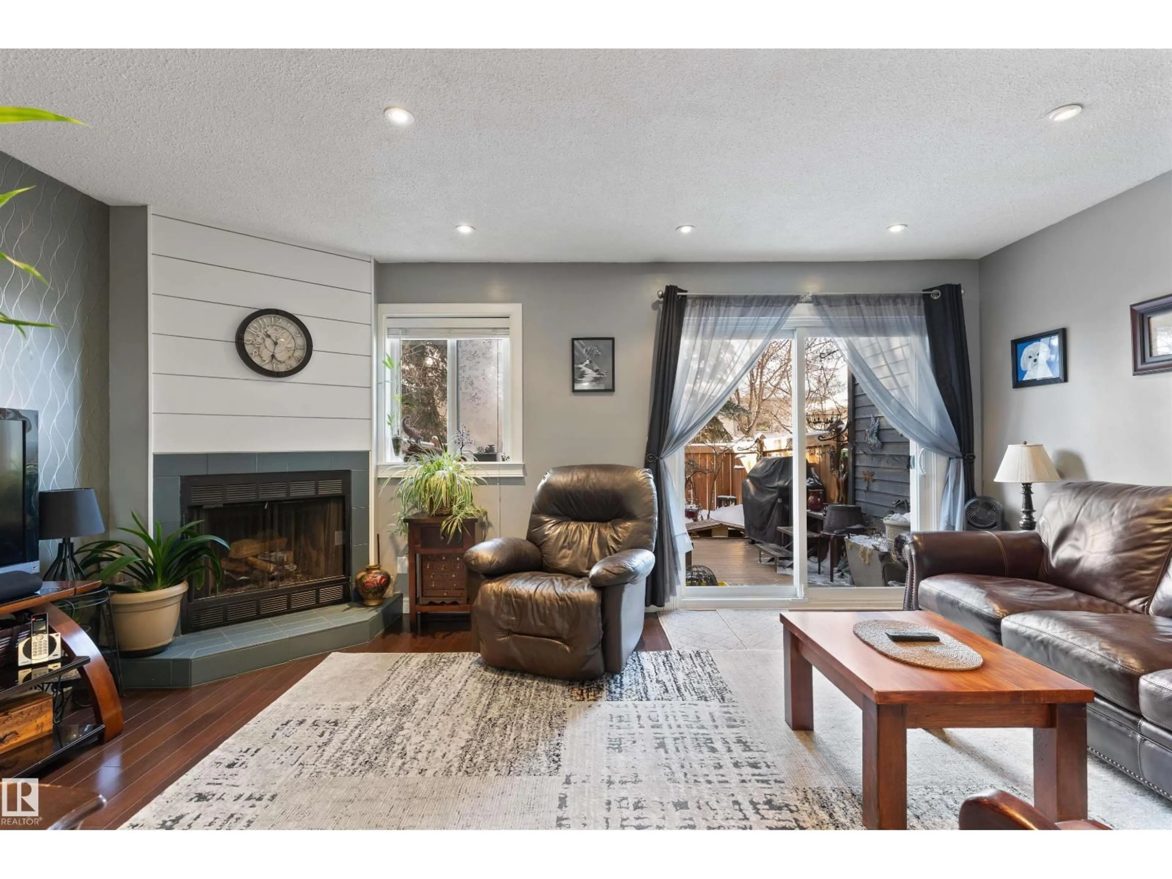 Living room with furniture, wood/laminate floor for 81 - 115 GARDEN RD, St. Albert Alberta T8N5G8