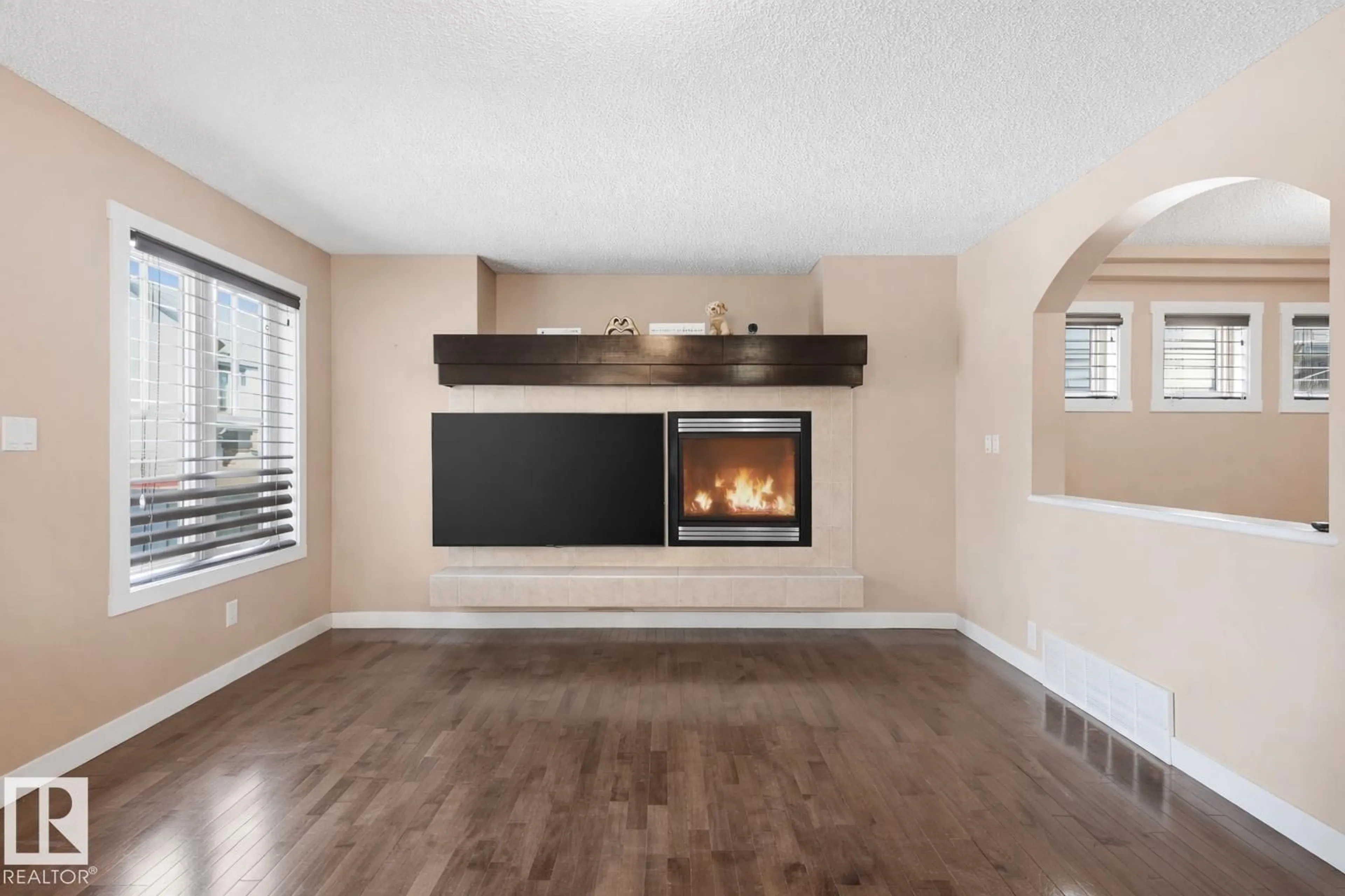 Living room with furniture, wood/laminate floor for 2608 ANDERSON CR, Edmonton Alberta T6W0K9
