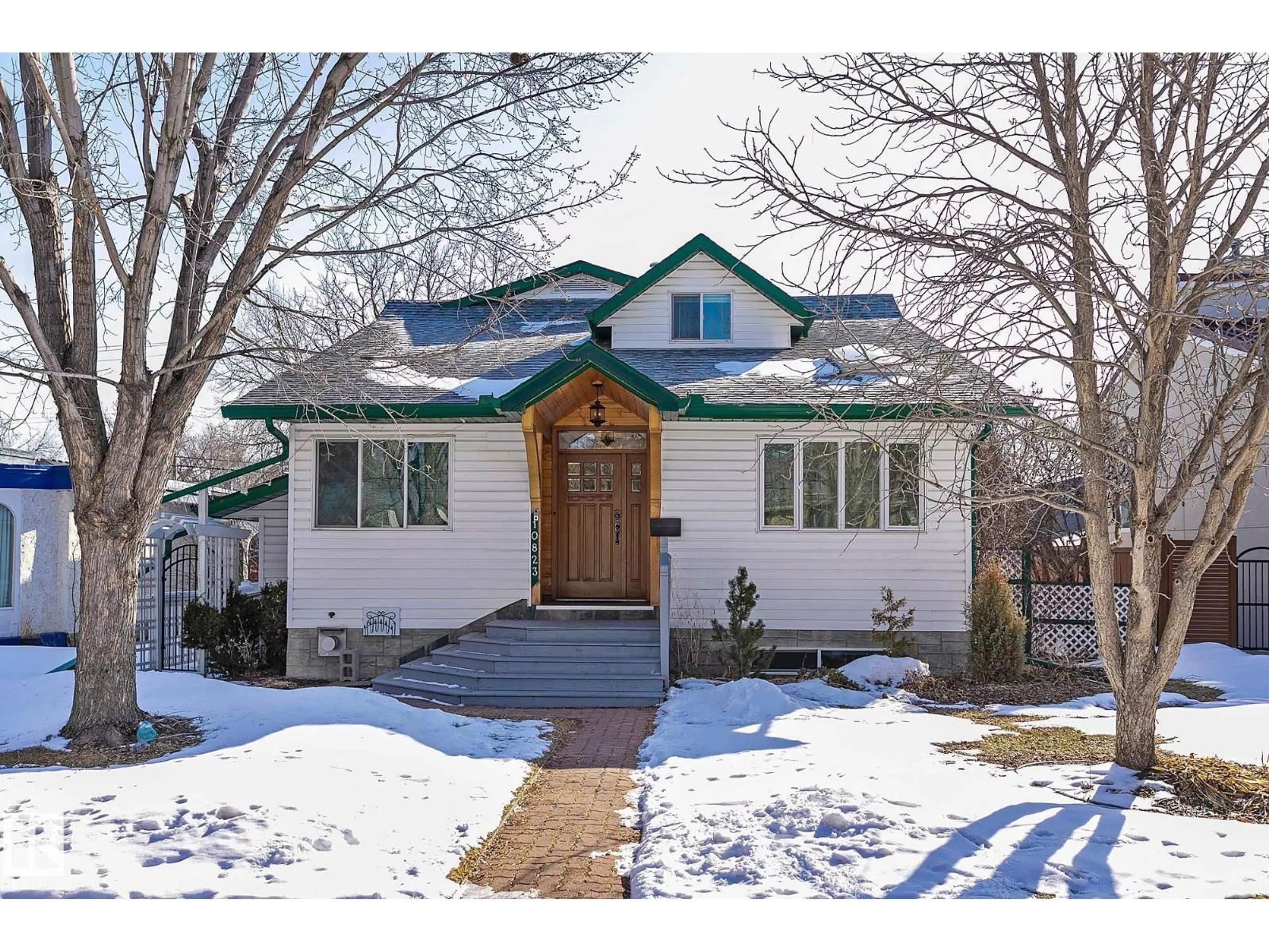 Home with brick exterior material, street for NW - 10823 130 ST, Edmonton Alberta T5M0Z2