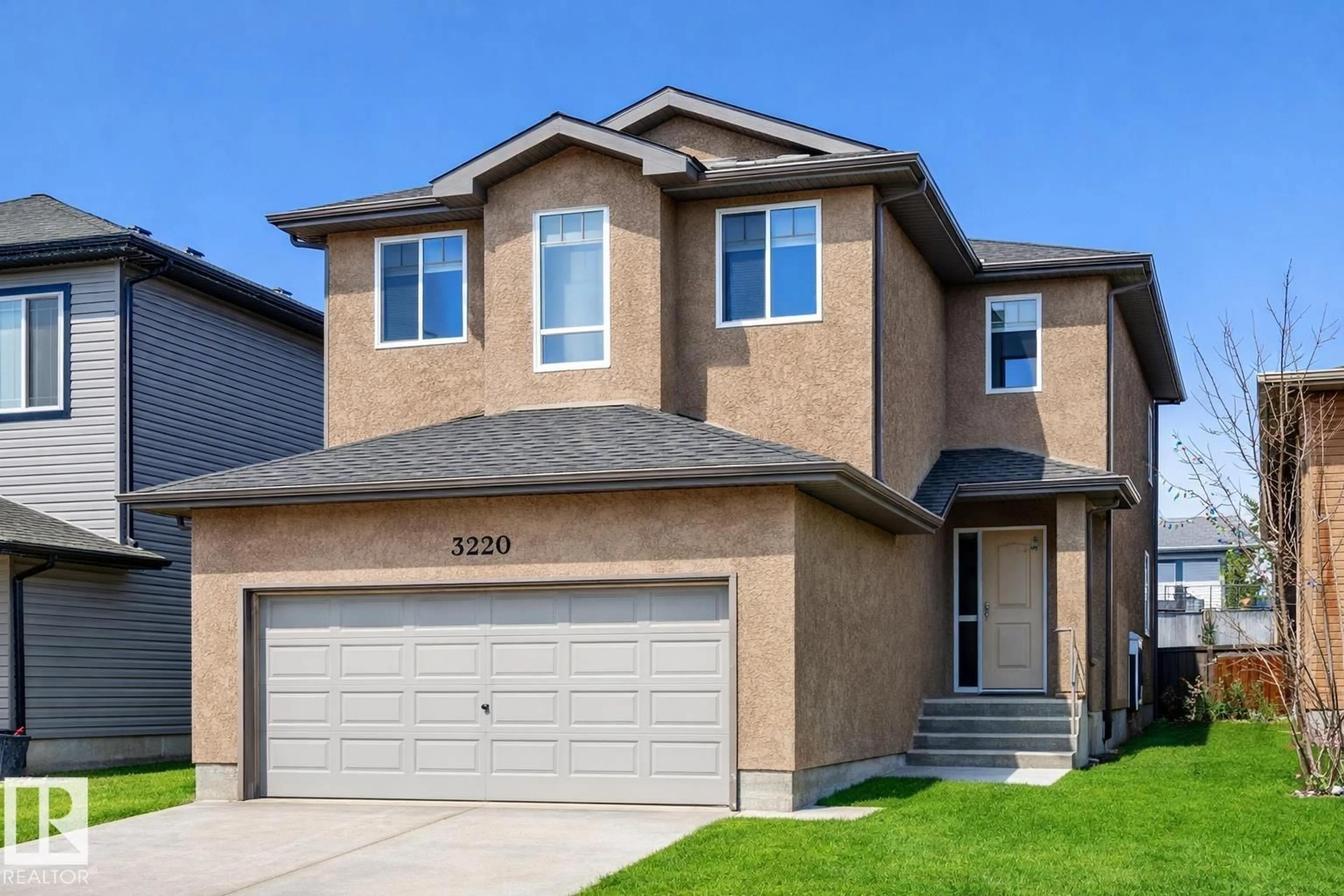 Home with vinyl exterior material, street for 3220 151 AV, Edmonton Alberta T5Y0J9
