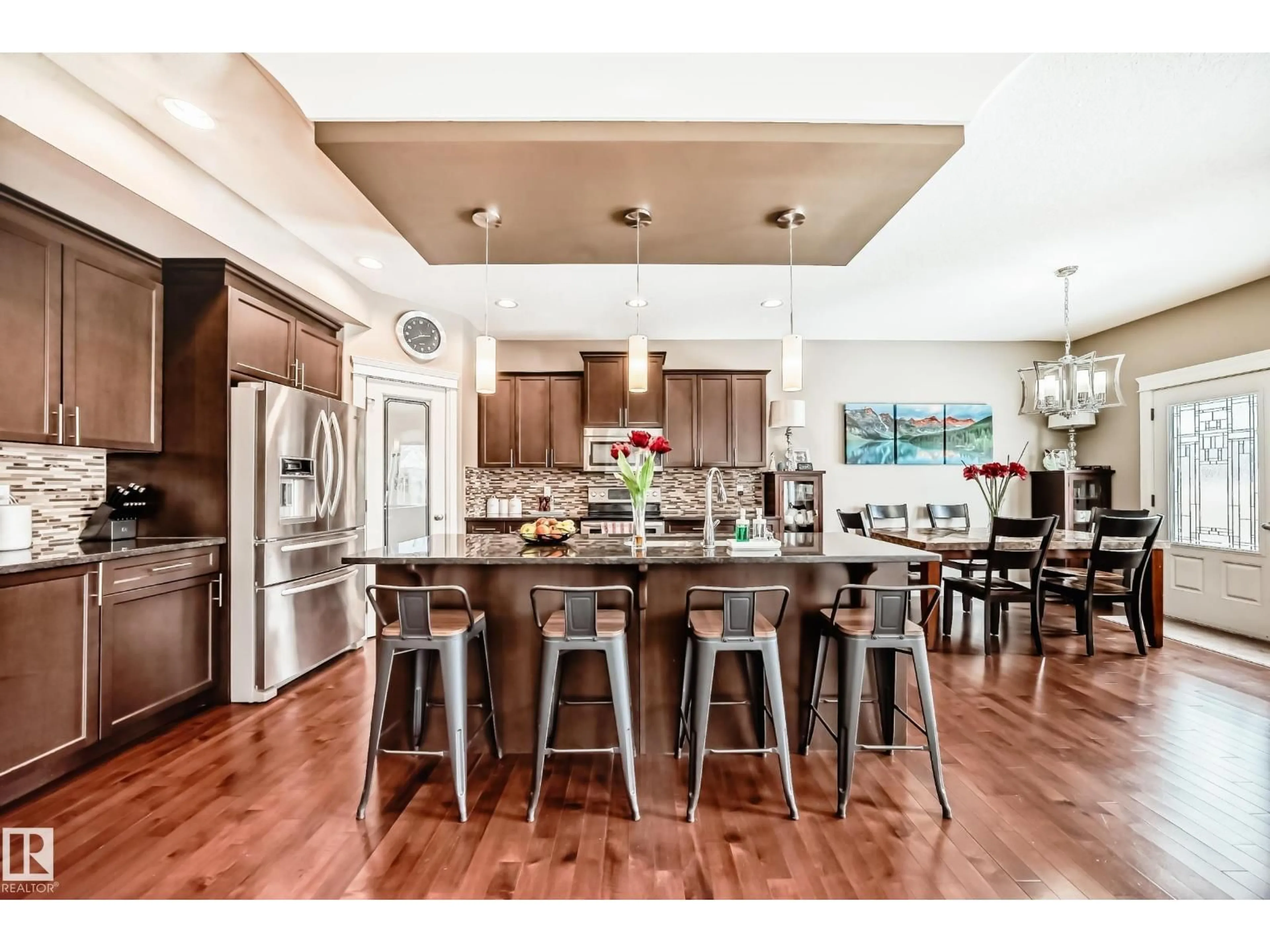 Open concept kitchen, wood/laminate floor for 3220 151 AV, Edmonton Alberta T5Y0J9