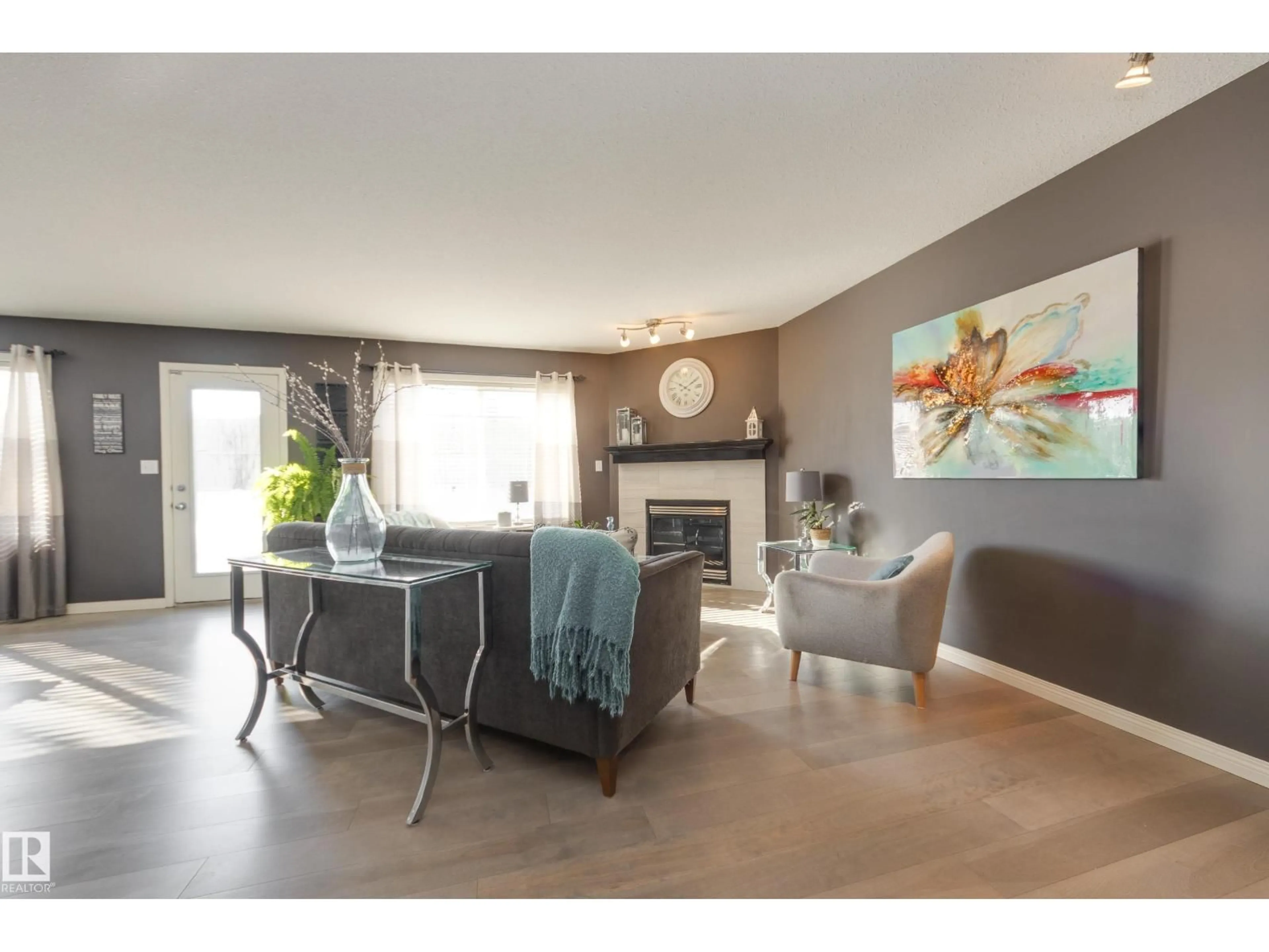 Living room with furniture, wood/laminate floor for 25 RIDGEHAVEN CR, Sherwood Park Alberta T8A6H9
