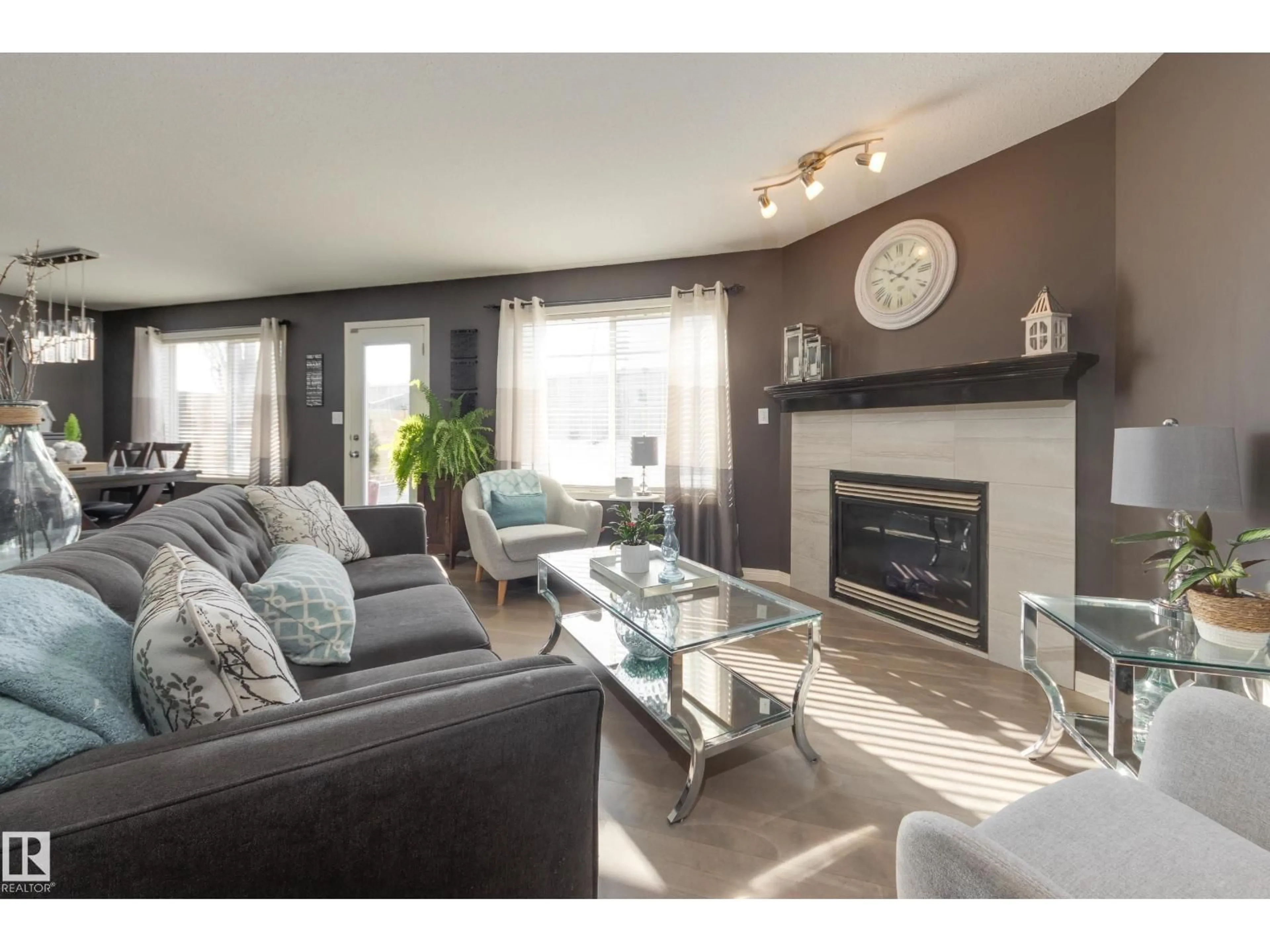 Living room with furniture, wood/laminate floor for 25 RIDGEHAVEN CR, Sherwood Park Alberta T8A6H9