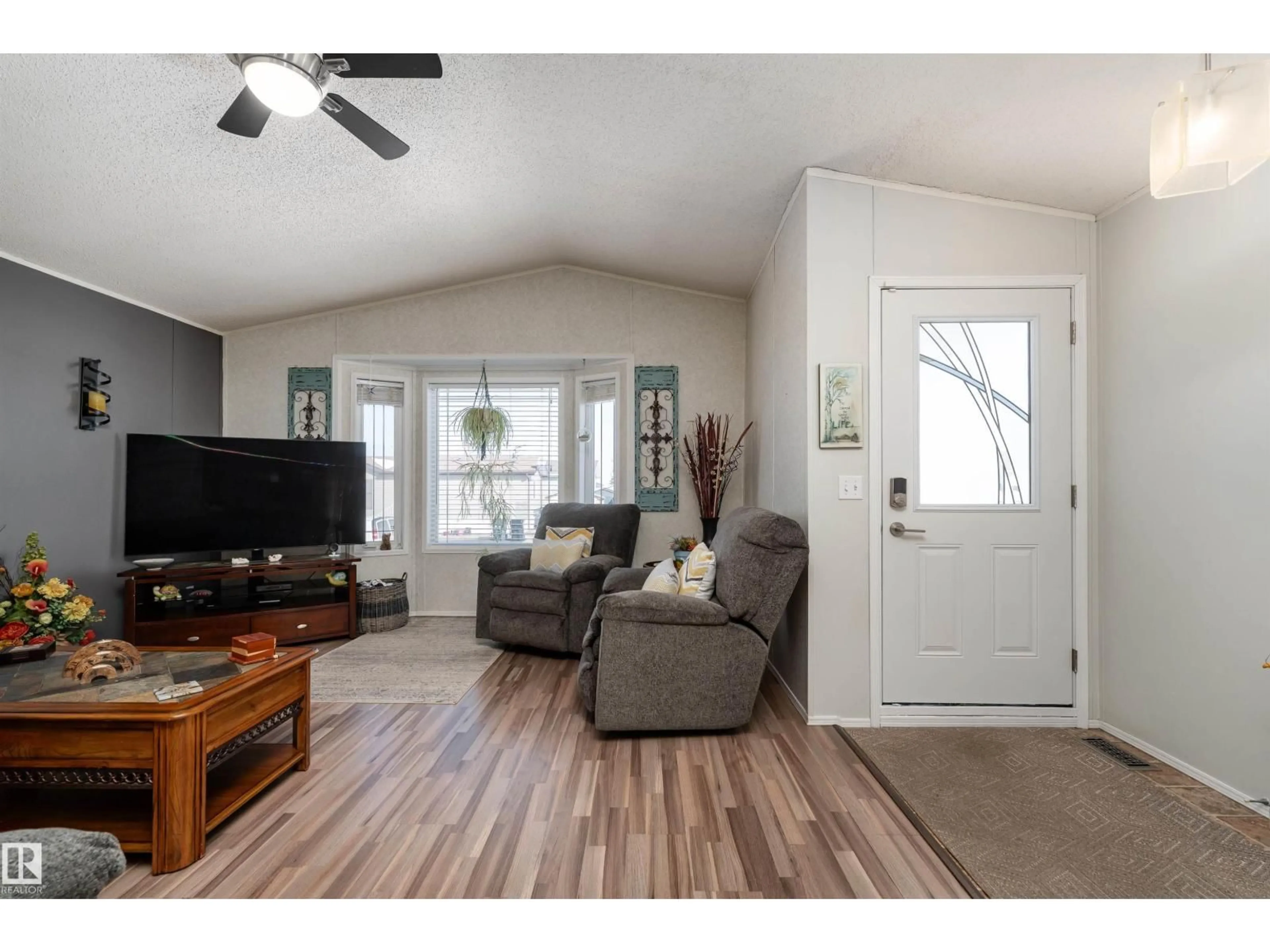 Living room with furniture, wood/laminate floor for 1981 JUBILEE RD, Sherwood Park Alberta T8H2N8