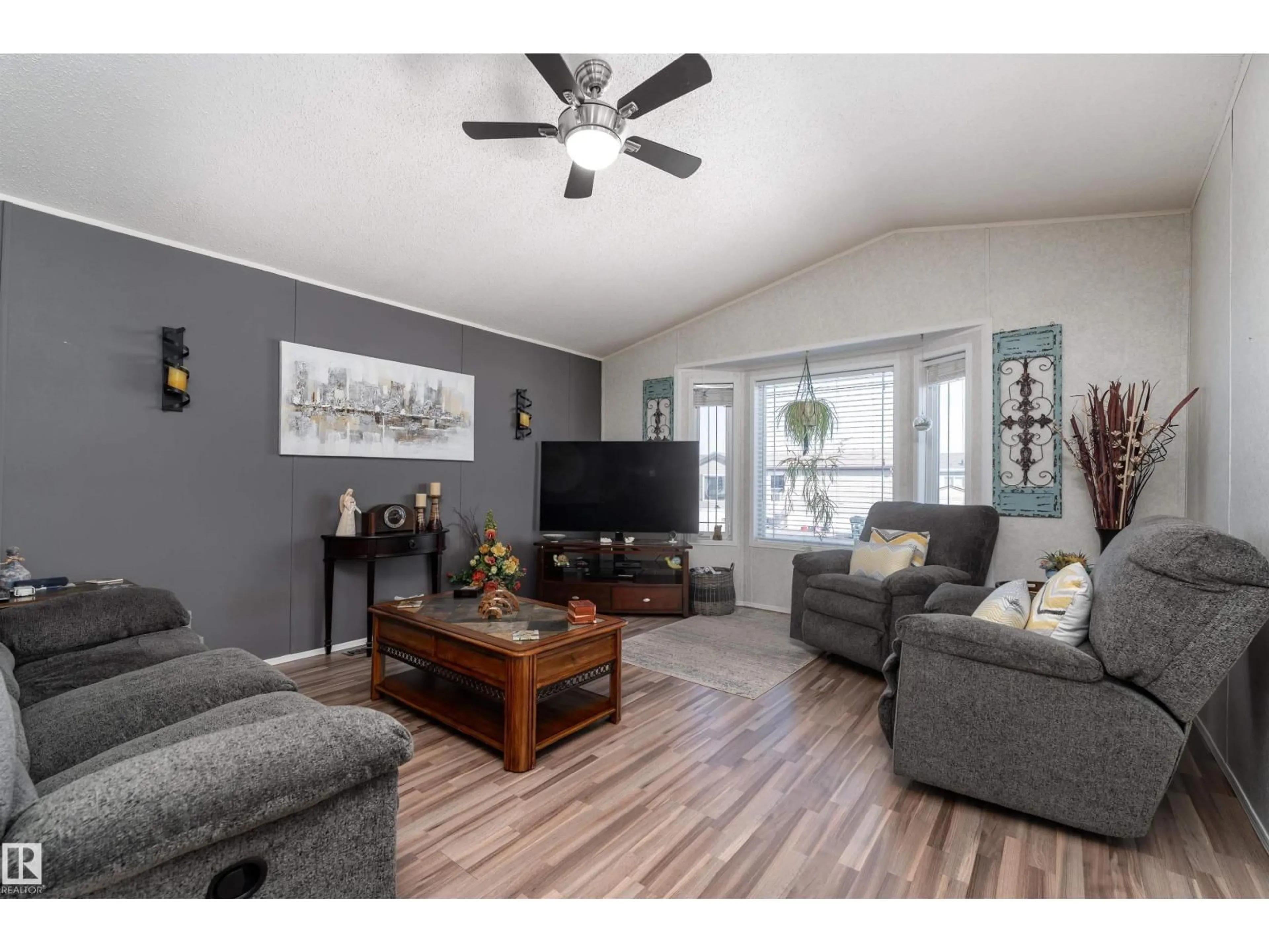 Living room with furniture, wood/laminate floor for 1981 JUBILEE RD, Sherwood Park Alberta T8H2N8