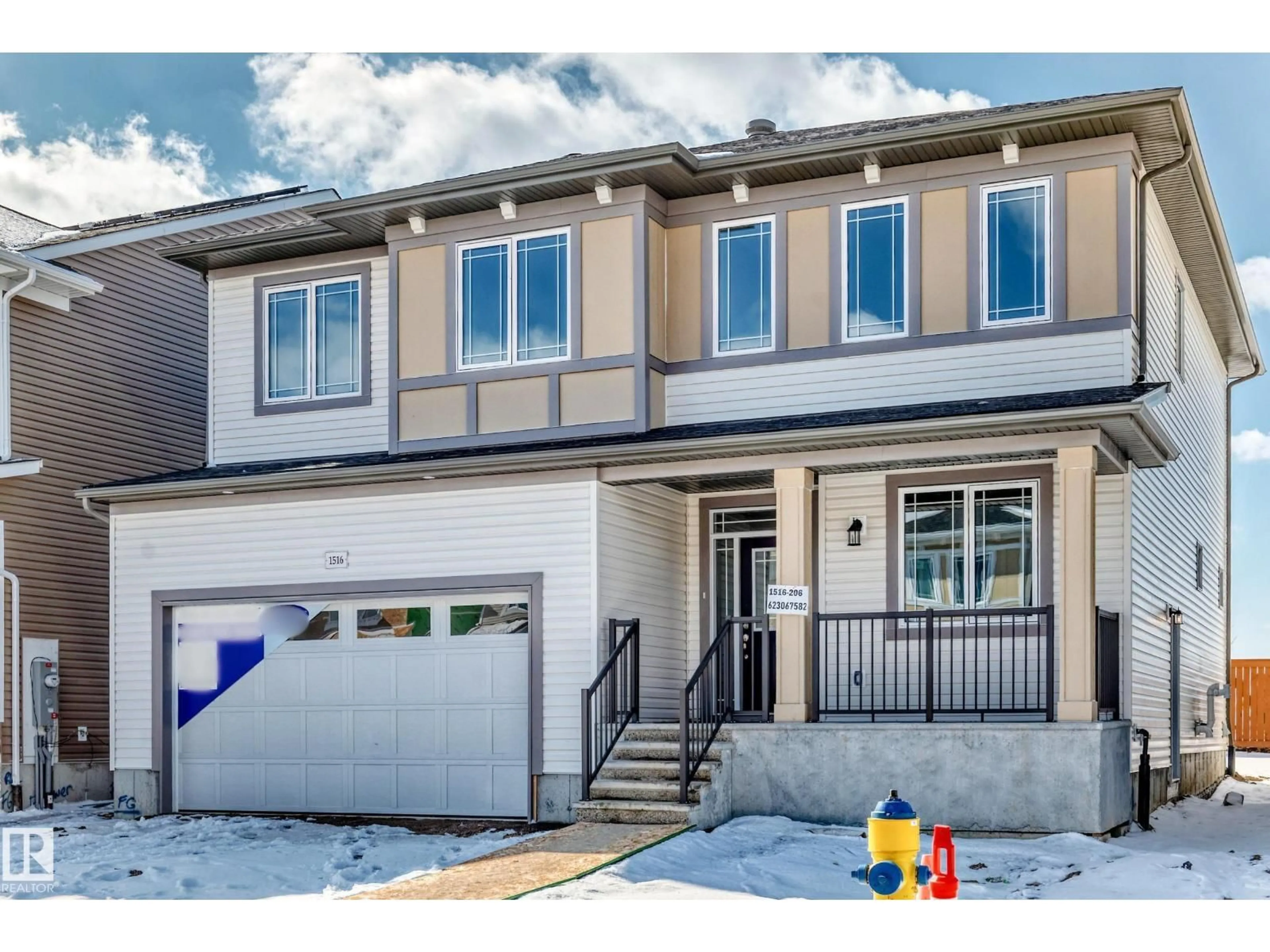 Home with vinyl exterior material, street for NW - 1516 206 ST, Edmonton Alberta T6M3E7