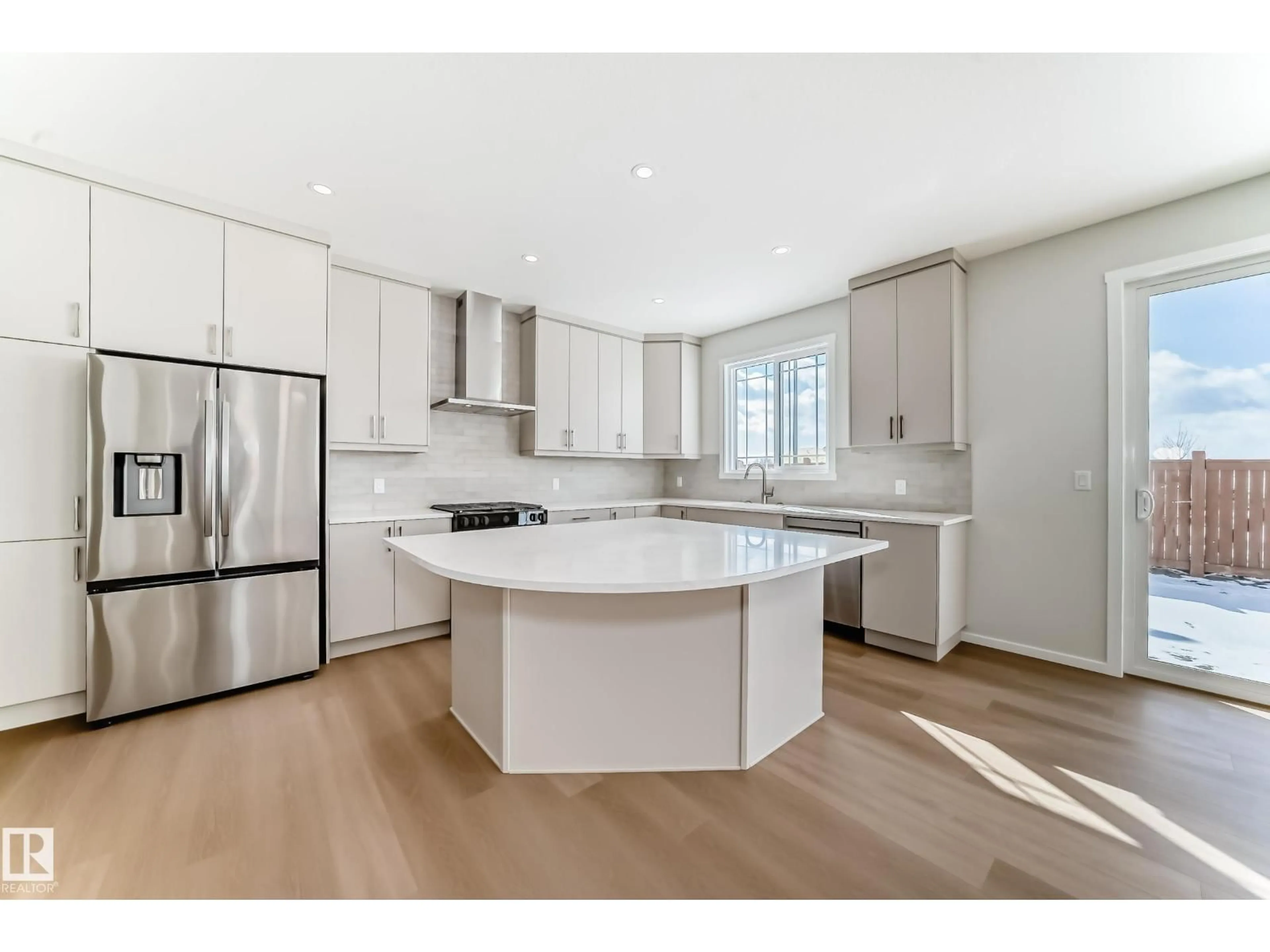 Open concept kitchen, wood/laminate floor for NW - 1516 206 ST, Edmonton Alberta T6M3E7