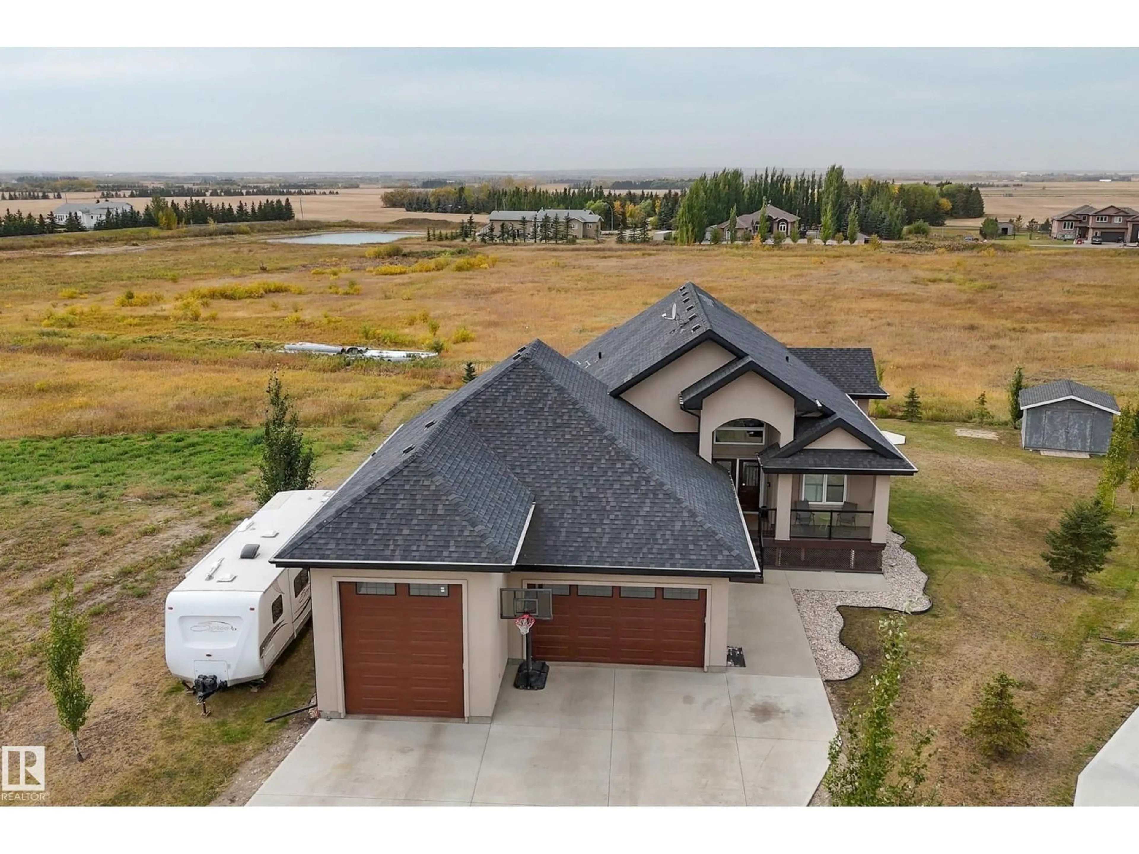 A pic from outside/outdoor area/front of a property/back of a property/a pic from drone, unknown for 209 - 26023 TWP ROAD 544, Rural Sturgeon County Alberta T8T0E4