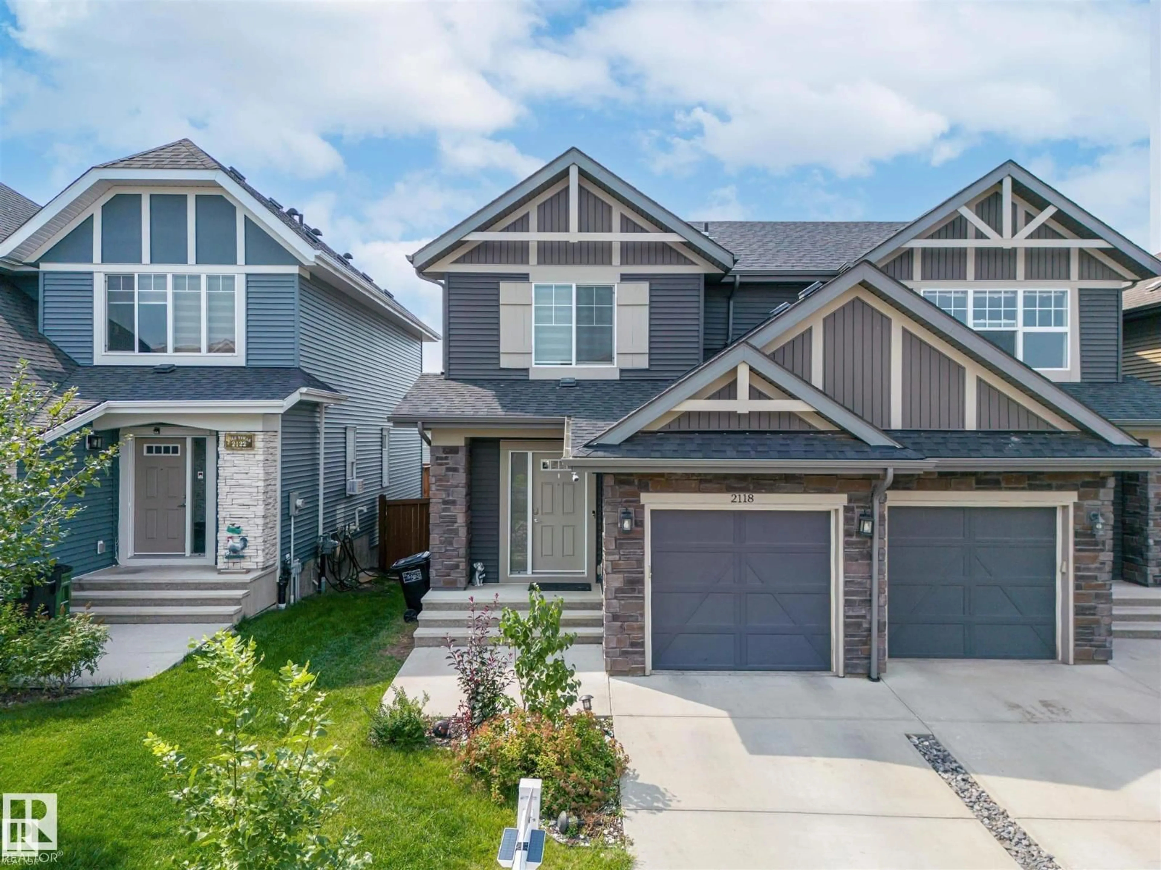 Home with vinyl exterior material, street for 2118 52A ST, Edmonton Alberta T6X1X4