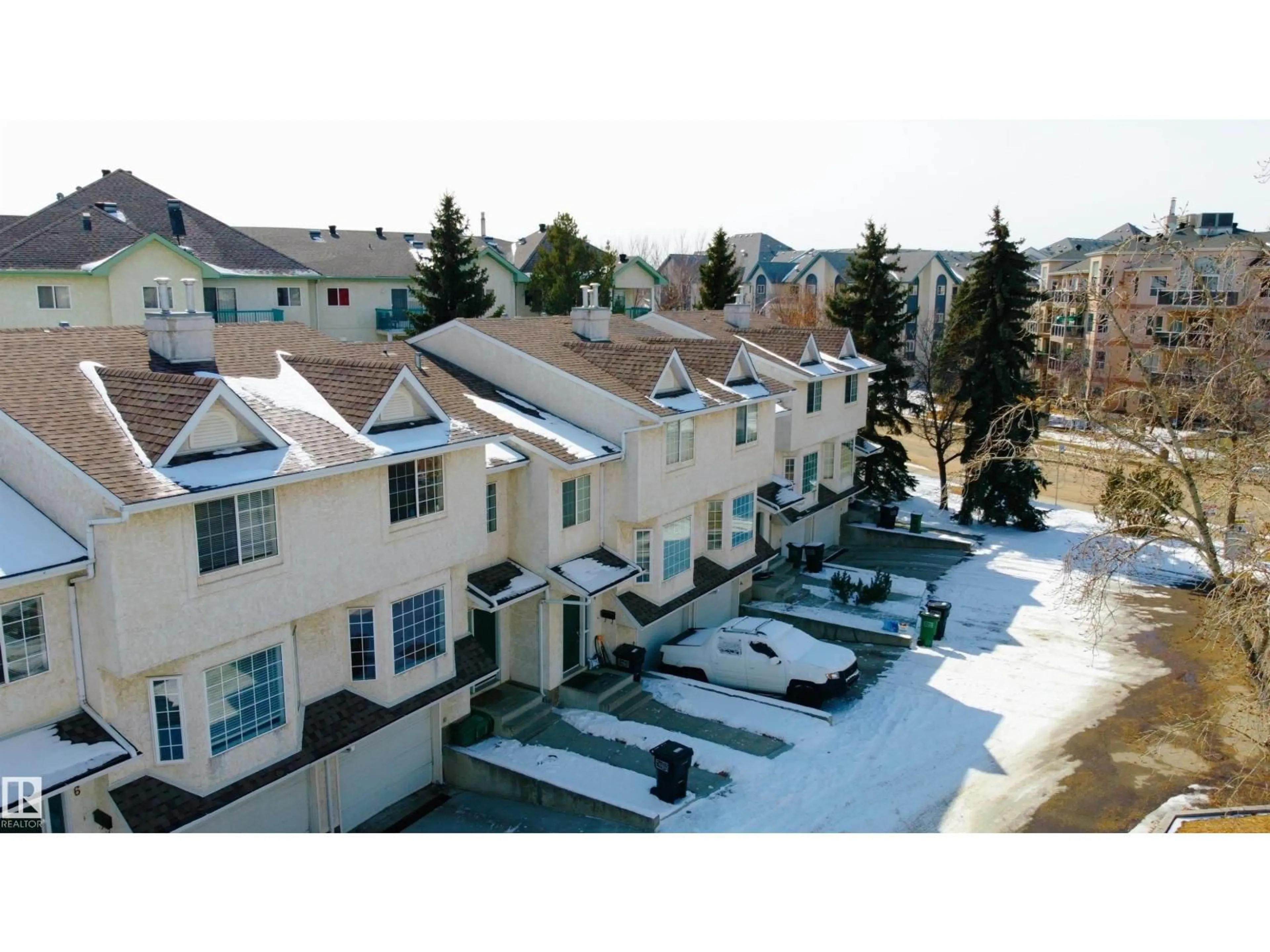 A pic from outside/outdoor area/front of a property/back of a property/a pic from drone, mountain view for #3 - 9703 174 ST, Edmonton Alberta T5T6C5