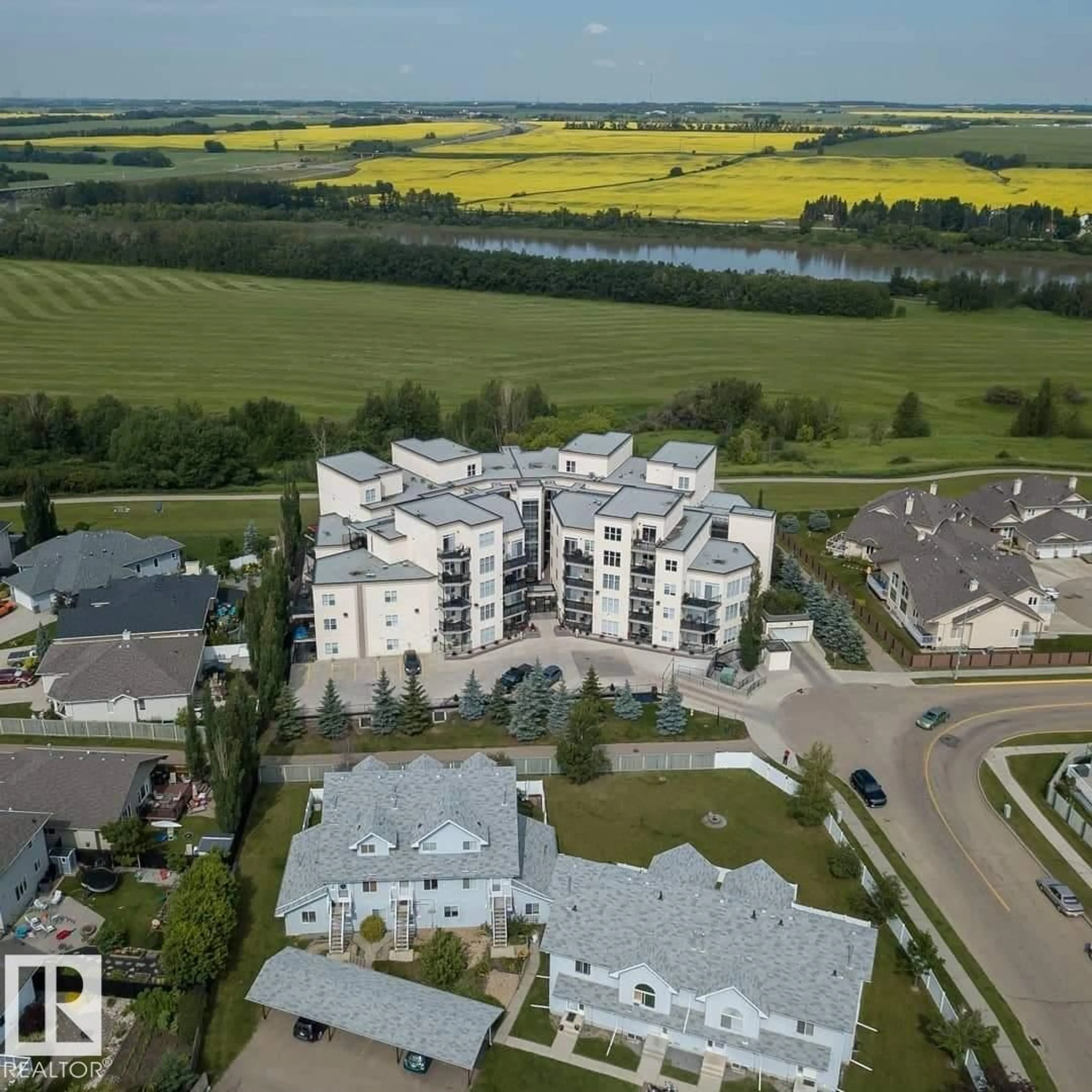 A pic from outside/outdoor area/front of a property/back of a property/a pic from drone, building for #214 - 9940 SHERRIDON DR, Fort Saskatchewan Alberta T8L4C9