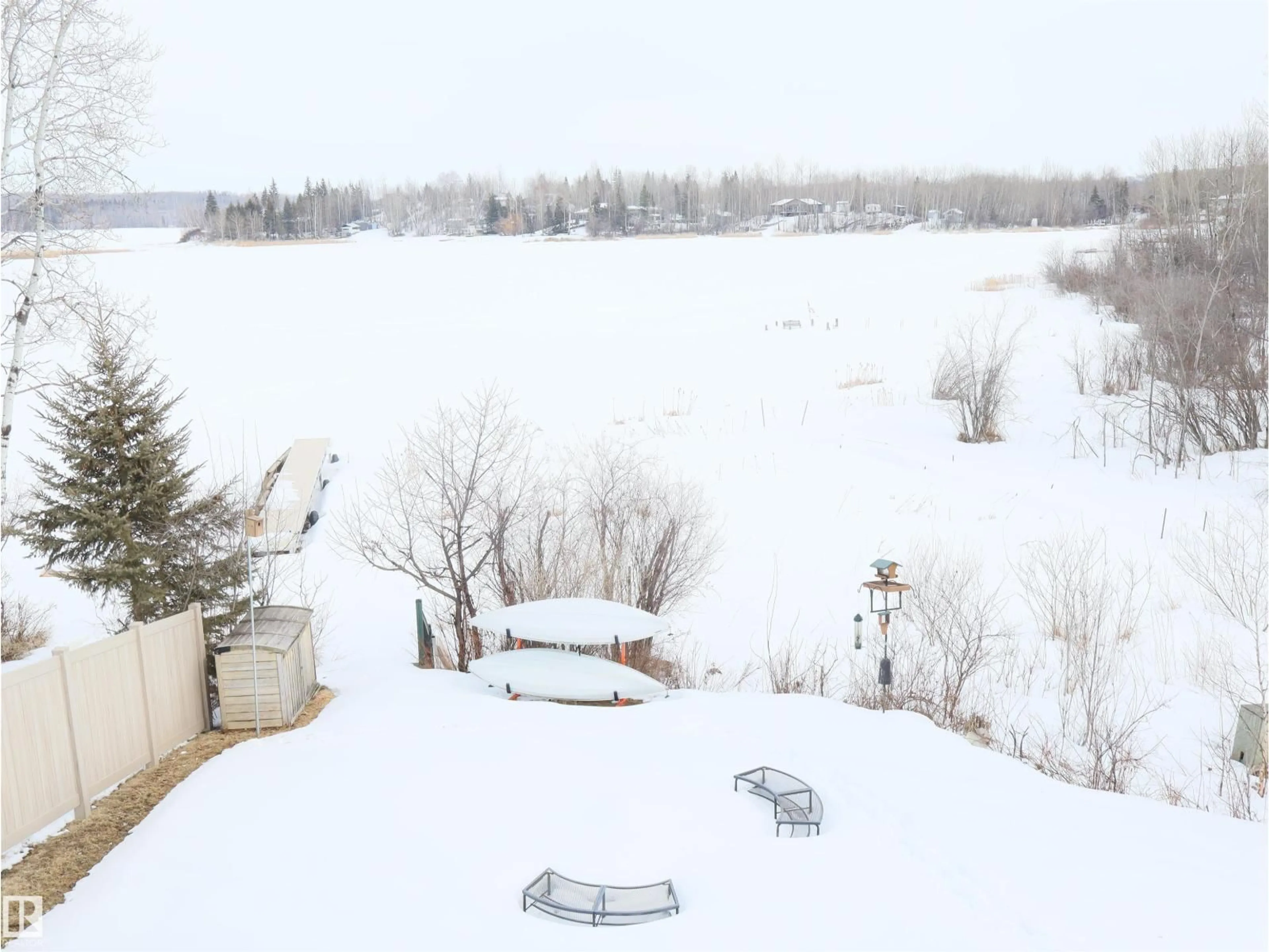 A pic from outside/outdoor area/front of a property/back of a property/a pic from drone, water/lake/river/ocean view for 66 - 5516 TWP. RD. 593A, Rural Barrhead County Alberta T7N1N3