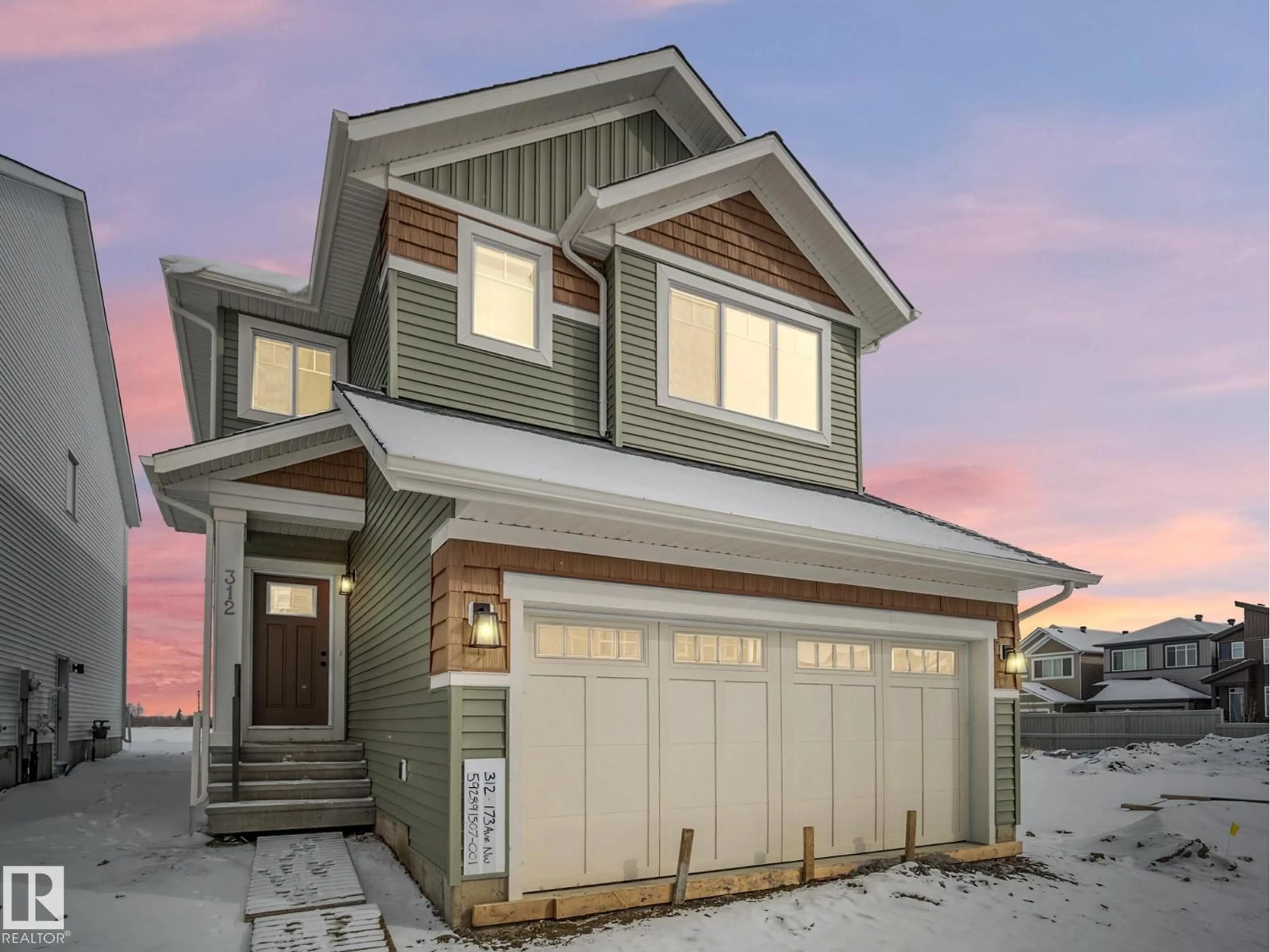 Home with vinyl exterior material, street for 312 173 AV, Edmonton Alberta T5Y4K7