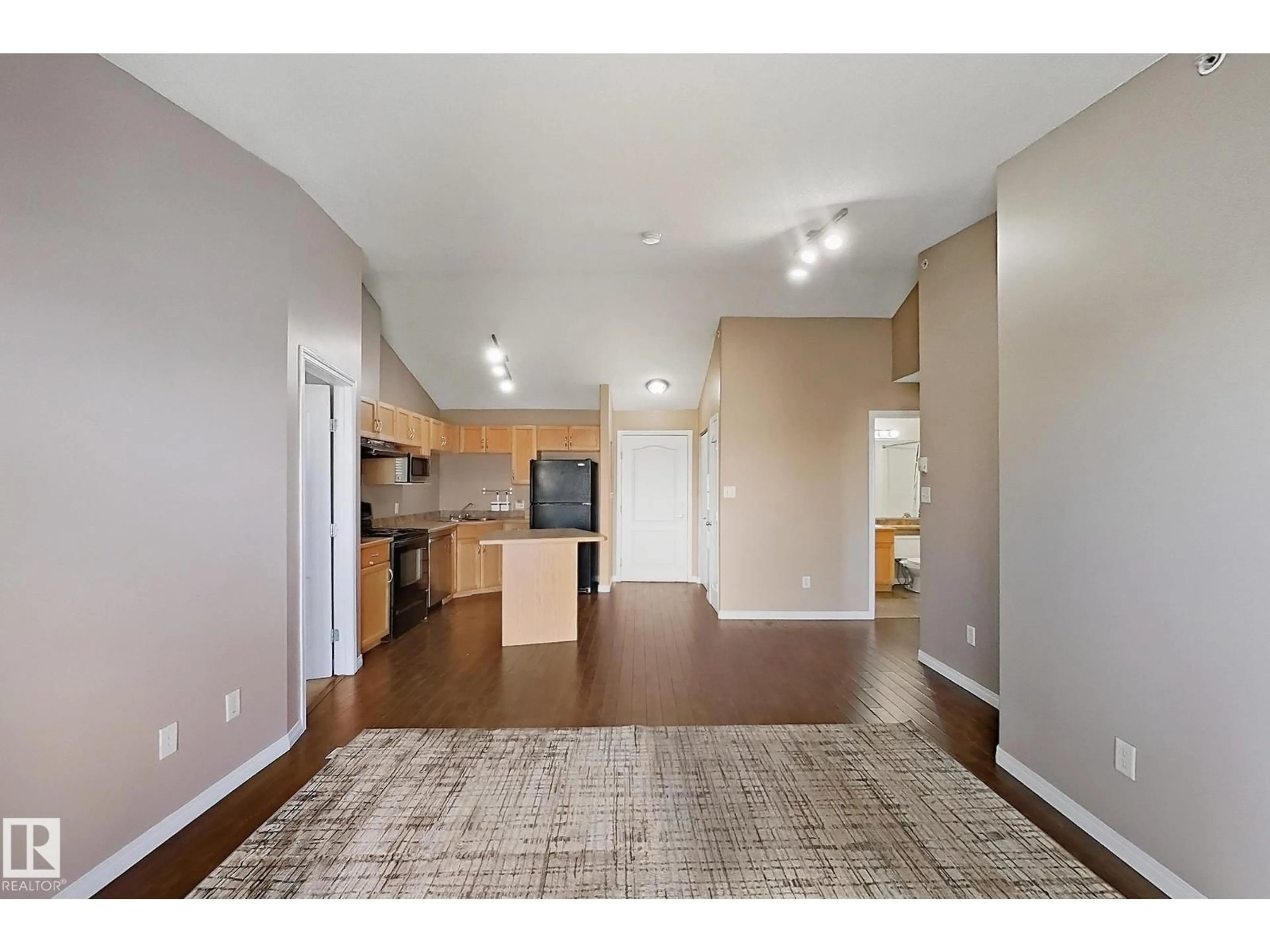 Open concept kitchen, wood/laminate floor for 421 3425 19 ST NW, Edmonton Alberta T6T2B5