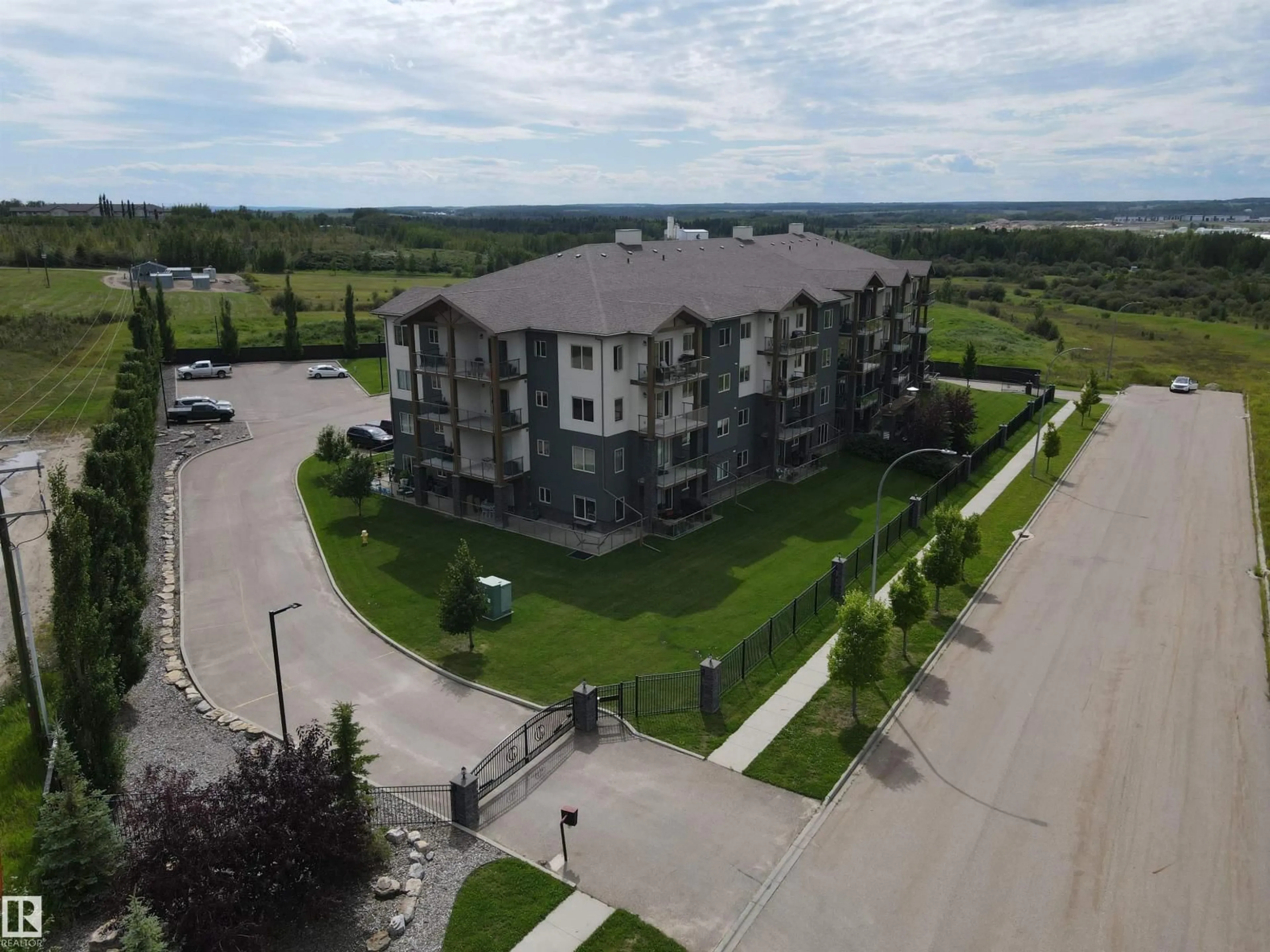 A pic from outside/outdoor area/front of a property/back of a property/a pic from drone, building for #109 - 5201 BROUGHAM DR, Drayton Valley Alberta T7A0A1