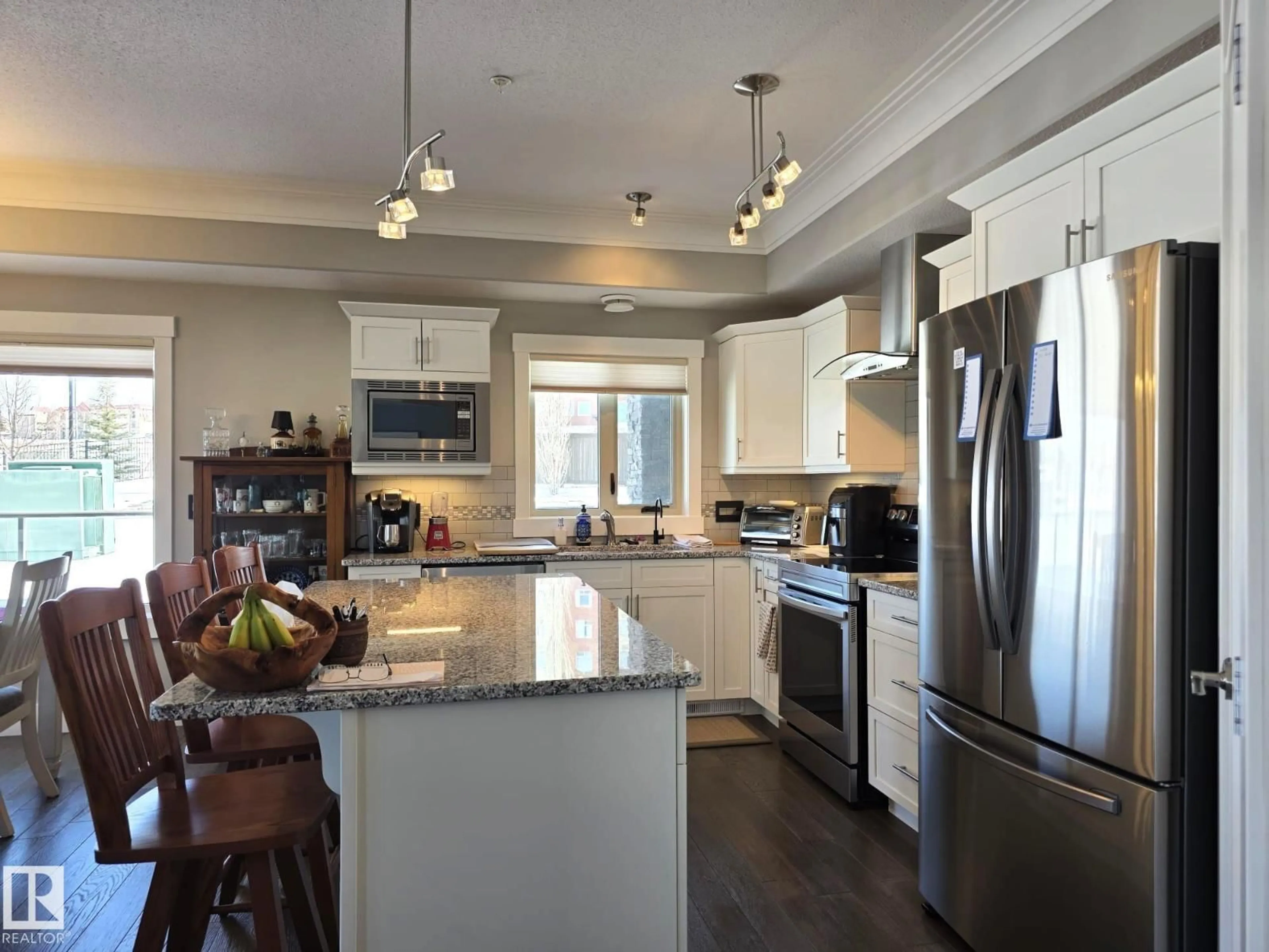 Open concept kitchen, wood/laminate floor for #109 - 5201 BROUGHAM DR, Drayton Valley Alberta T7A0A1