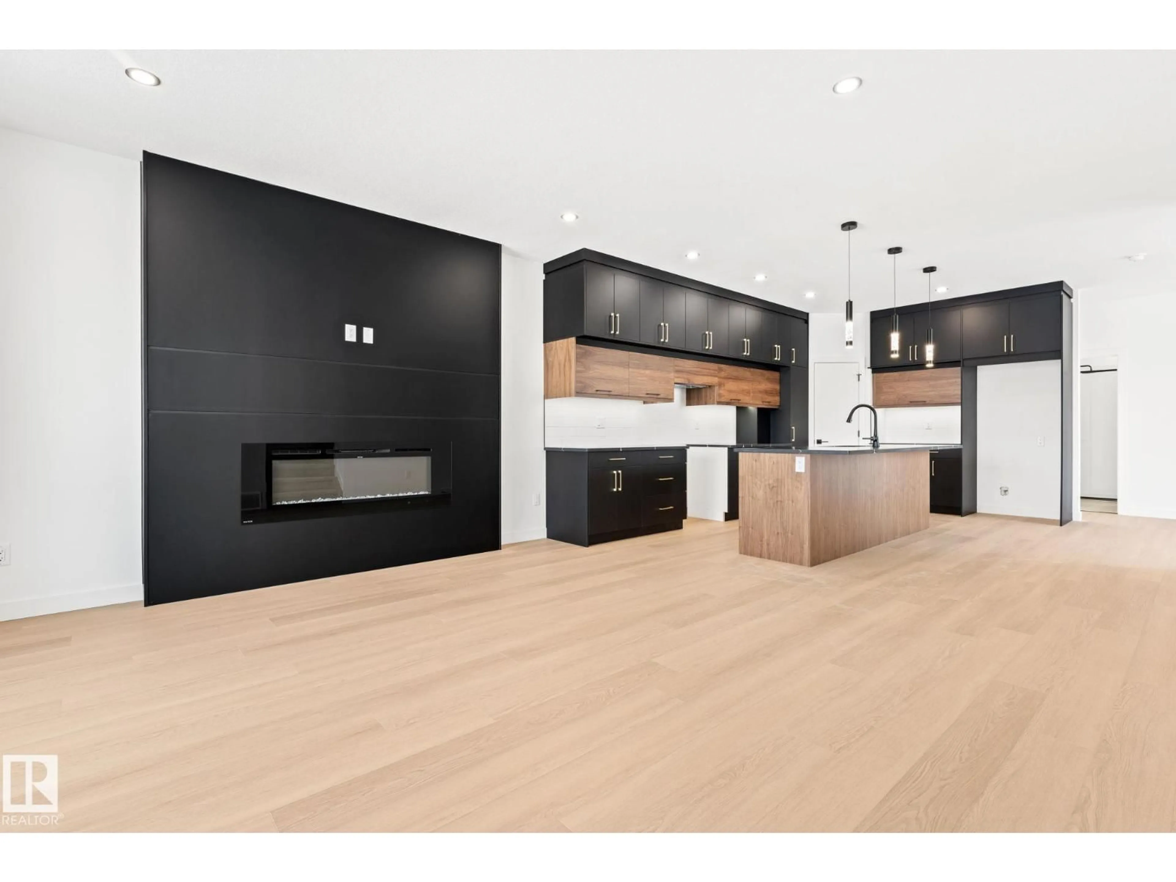 Open concept kitchen, wood/laminate floor for 94 BLACKBIRD BN, Fort Saskatchewan Alberta T8L0X9